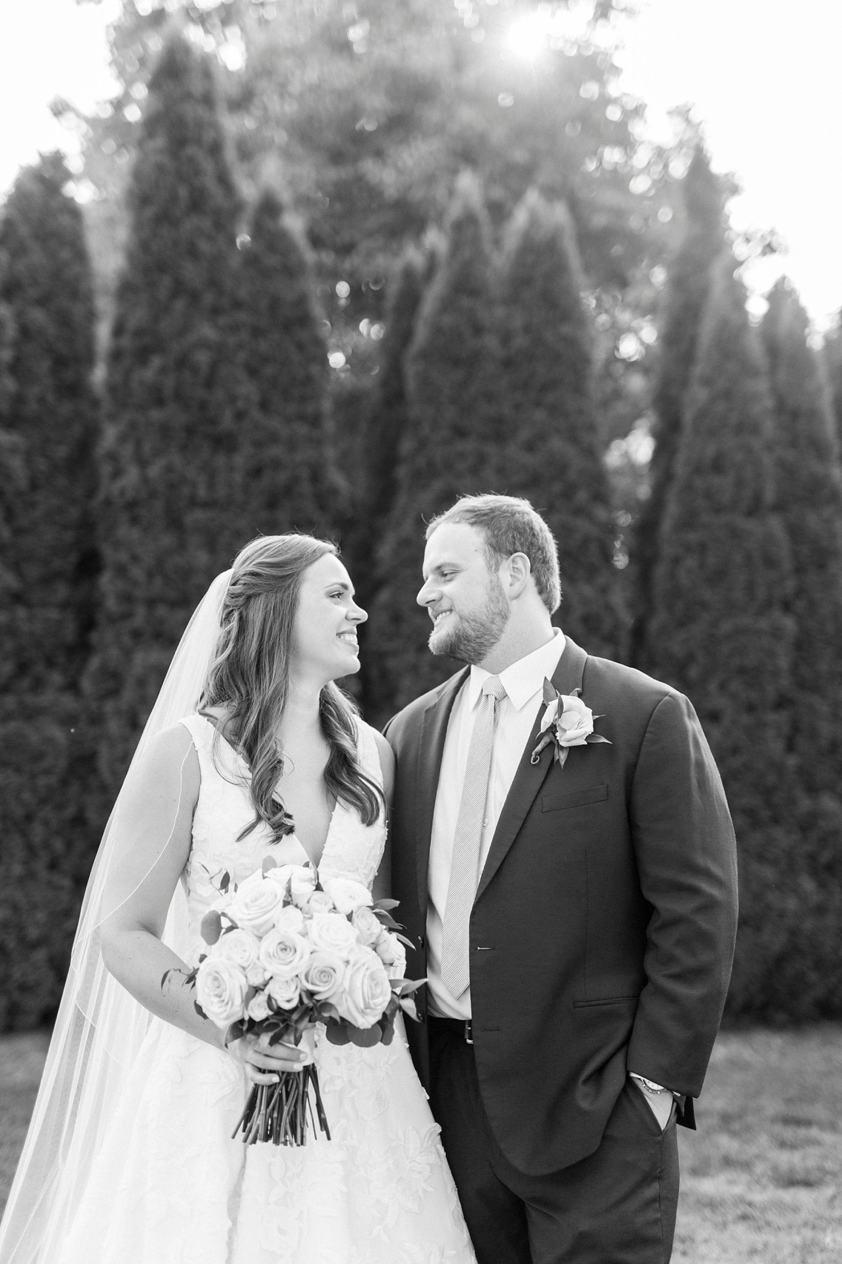 bride and groom smile at each other during The Inn at Crestwood wedding portraits