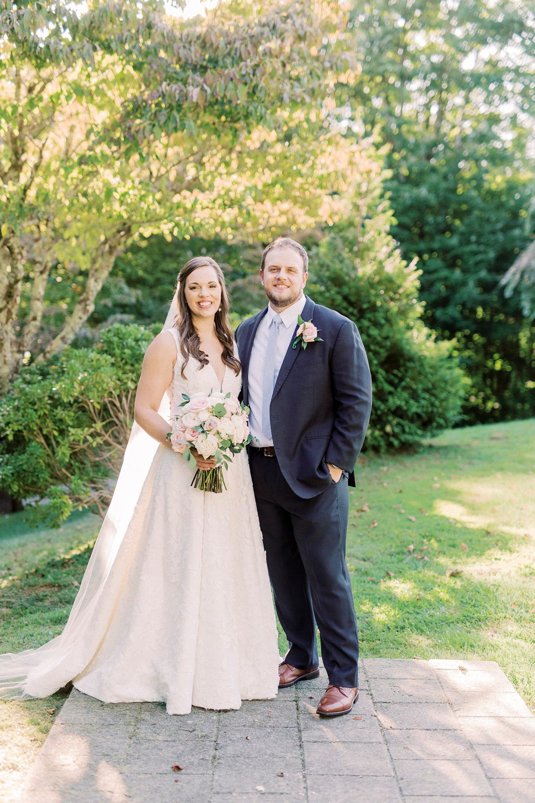 newlyweds stand together are The Inn at Crestwood ceremony