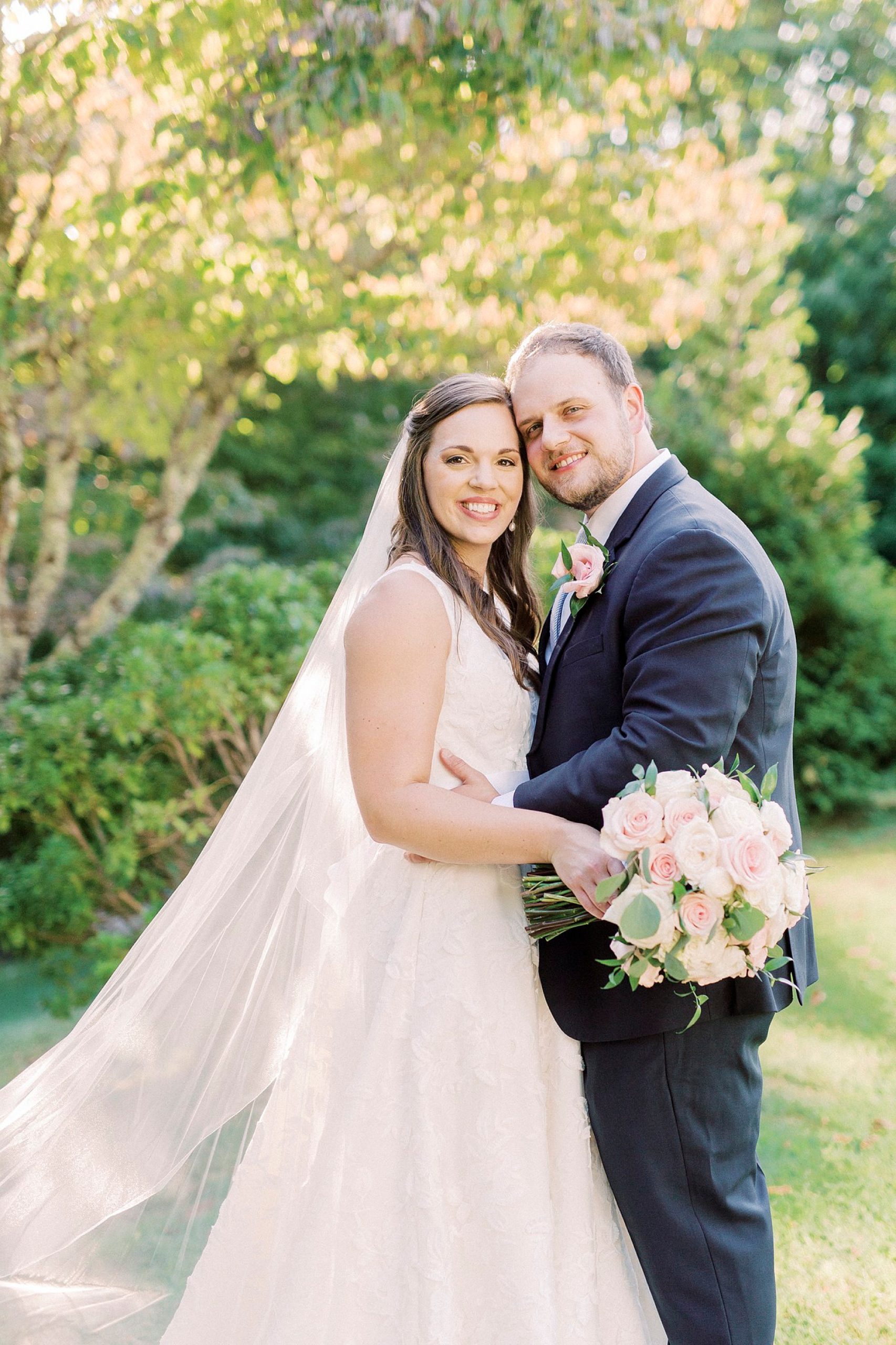 bride and groom hug together at The Inn at Crestwood