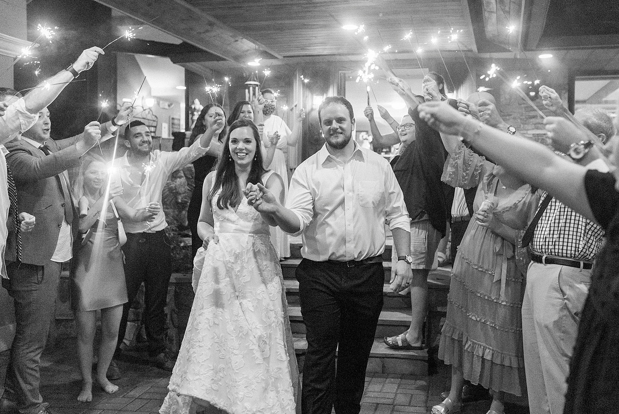 newlyweds leave Blowing Rock NC wedding reception during sparkler exit