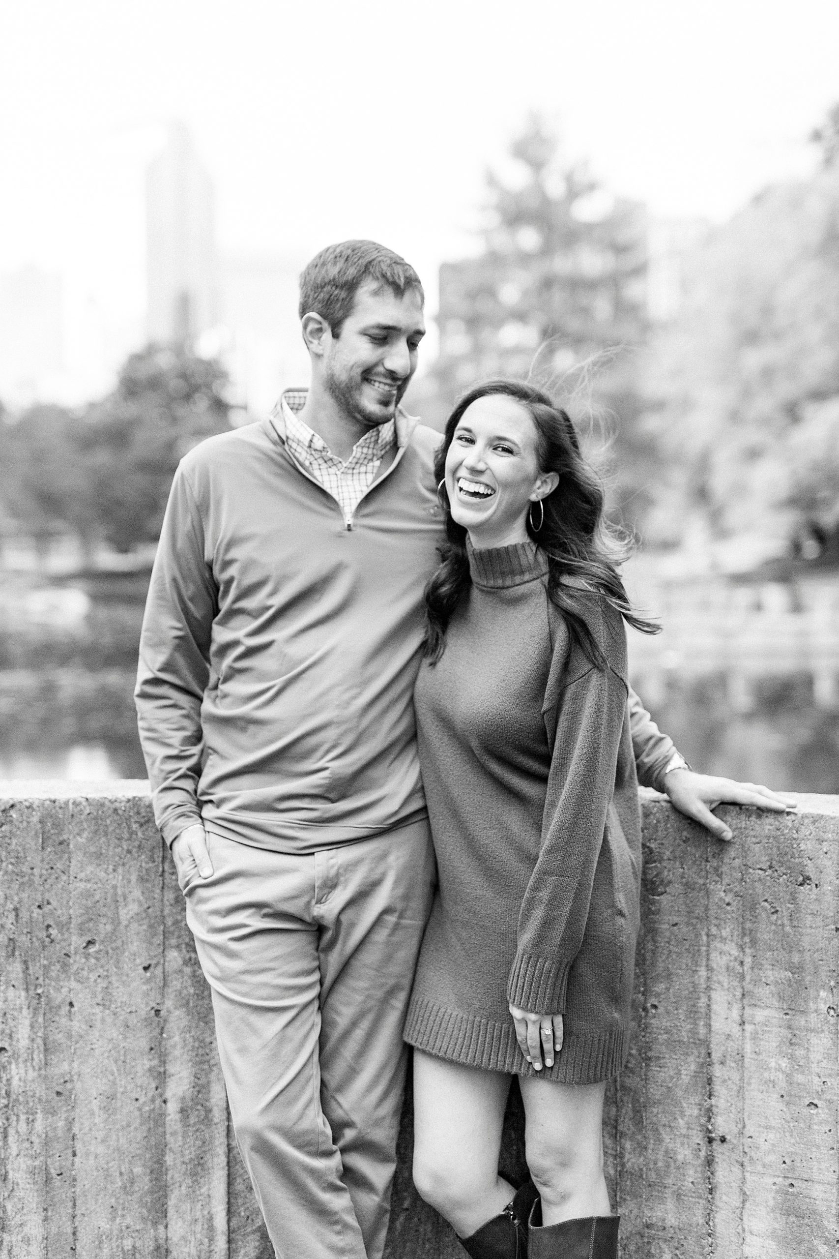 engaged couple laughs together during Marshall Park engagement session