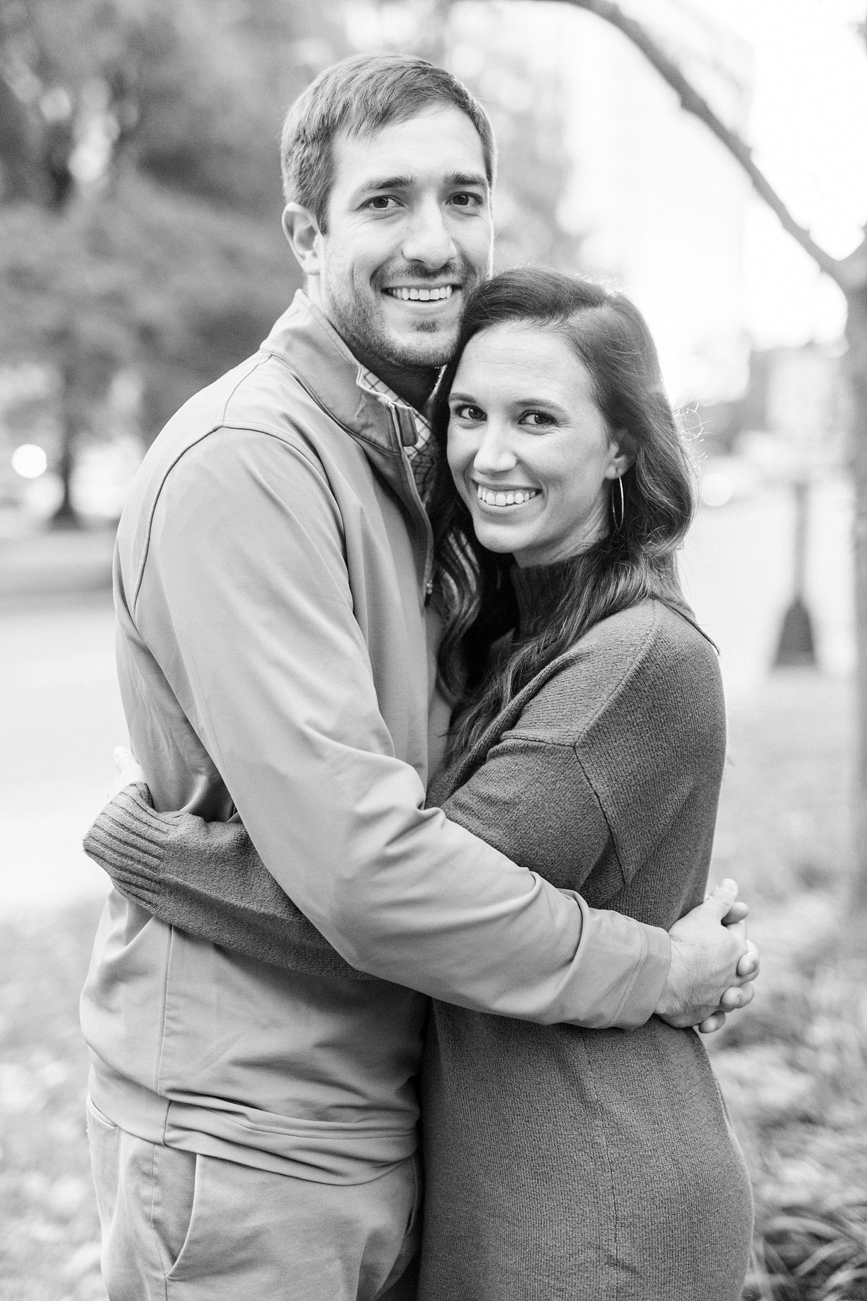 engaged couple hugs during Marshall Park engagement session