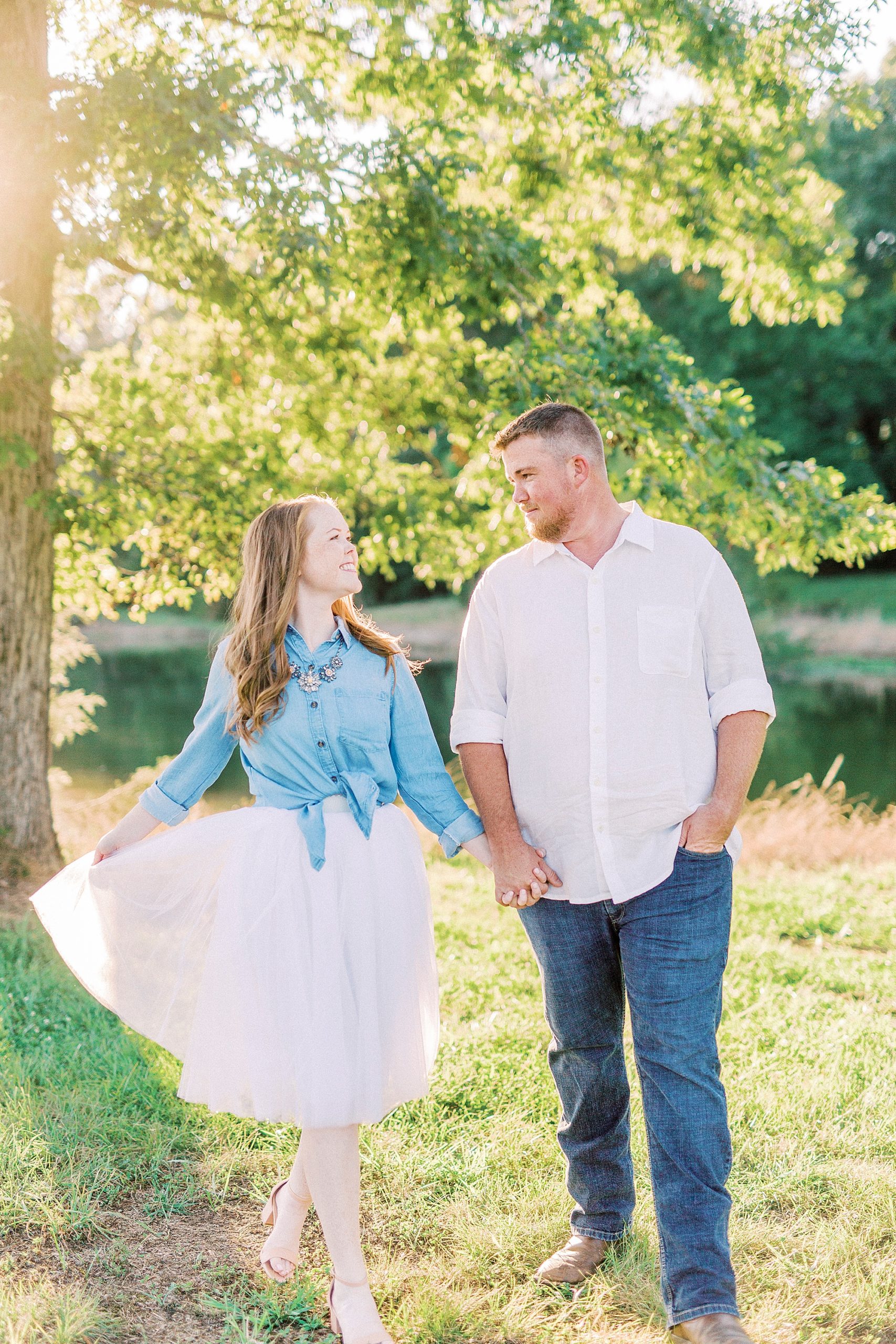 bride and groom look at each other during engagement session in Charlotte NC