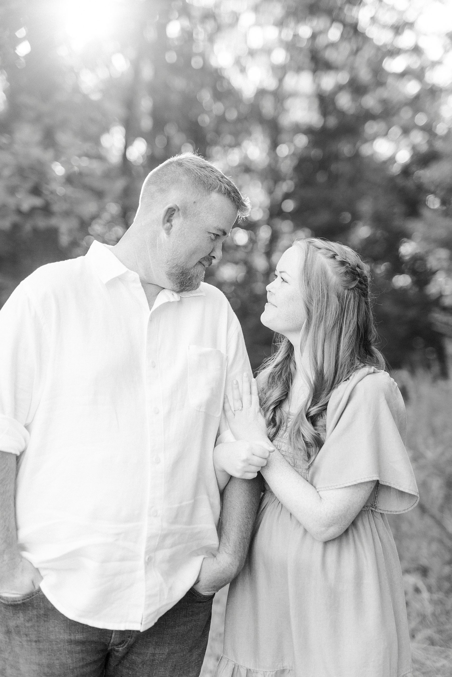 bride and groom smile together during Sunset Farm engagement session