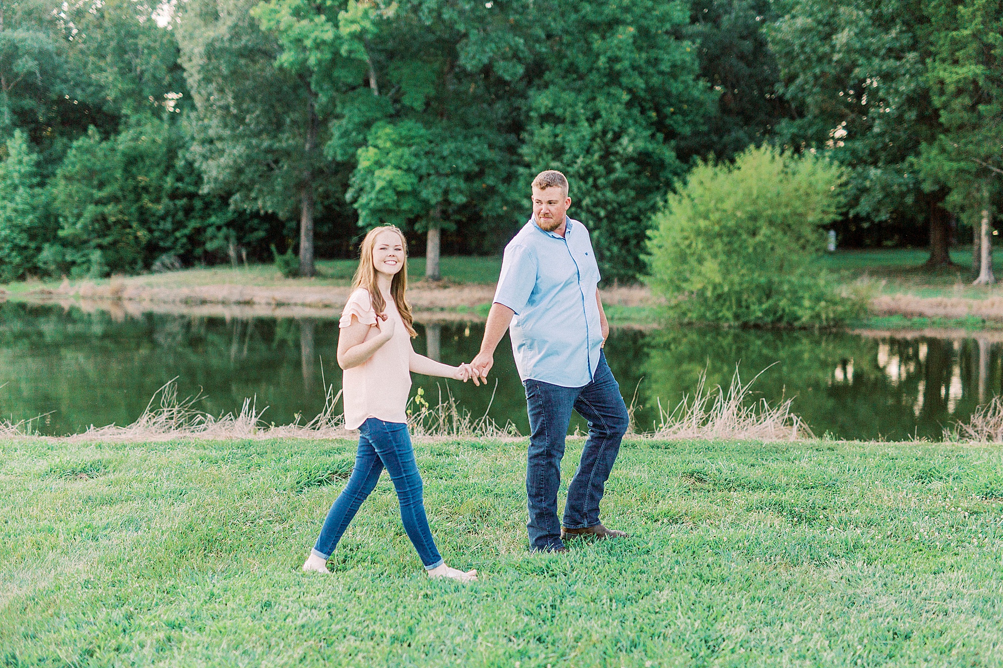 couple walks through Sunset Farm in Concord NC