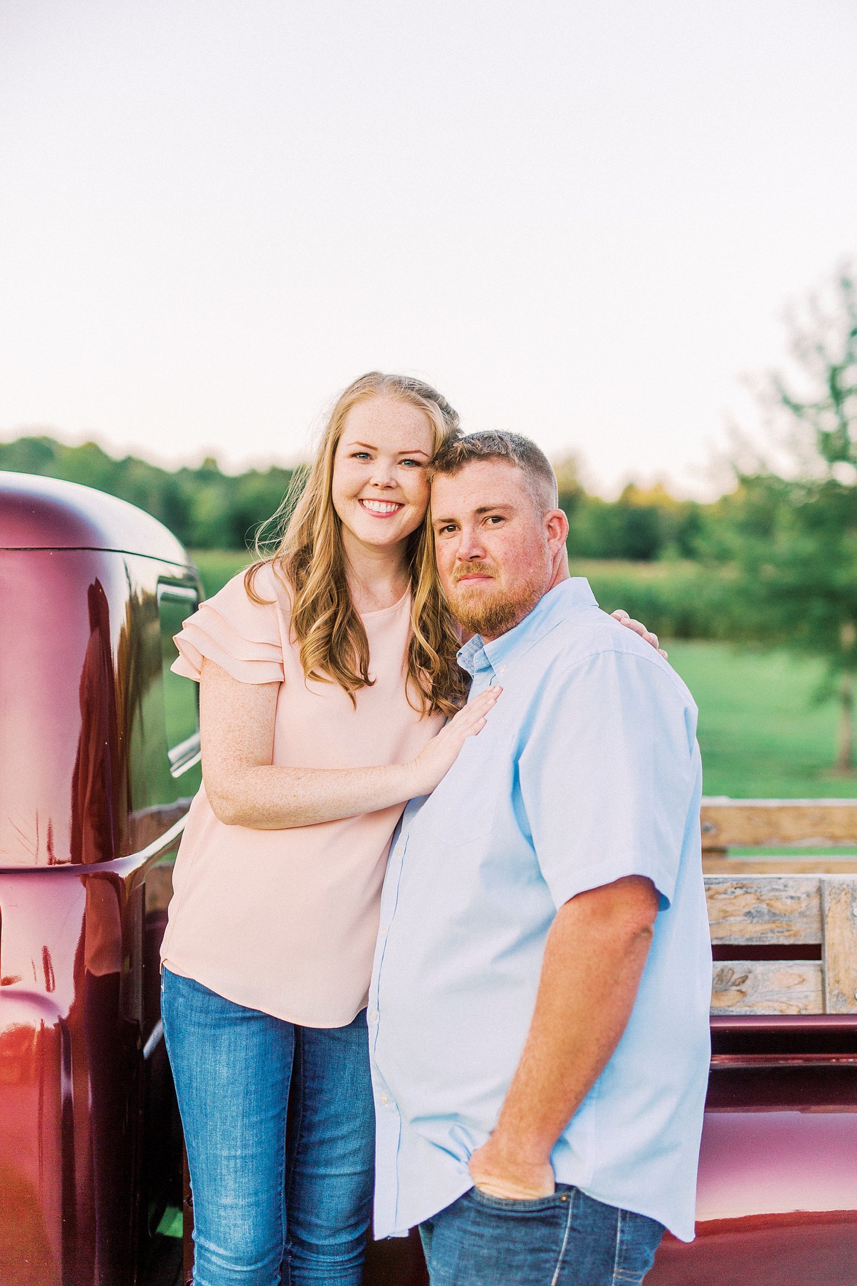 bride stands on side of vintage truck in Concord NC