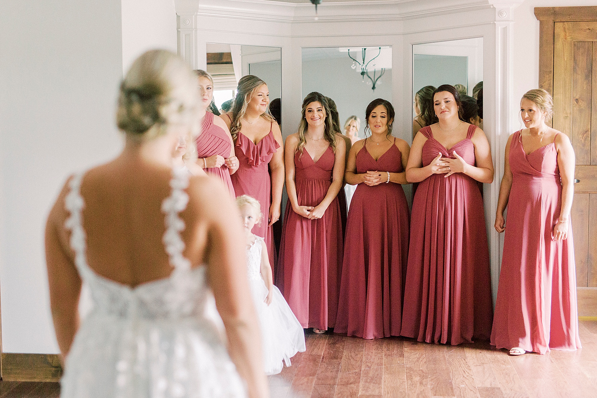 bride has first look with bridesmaids