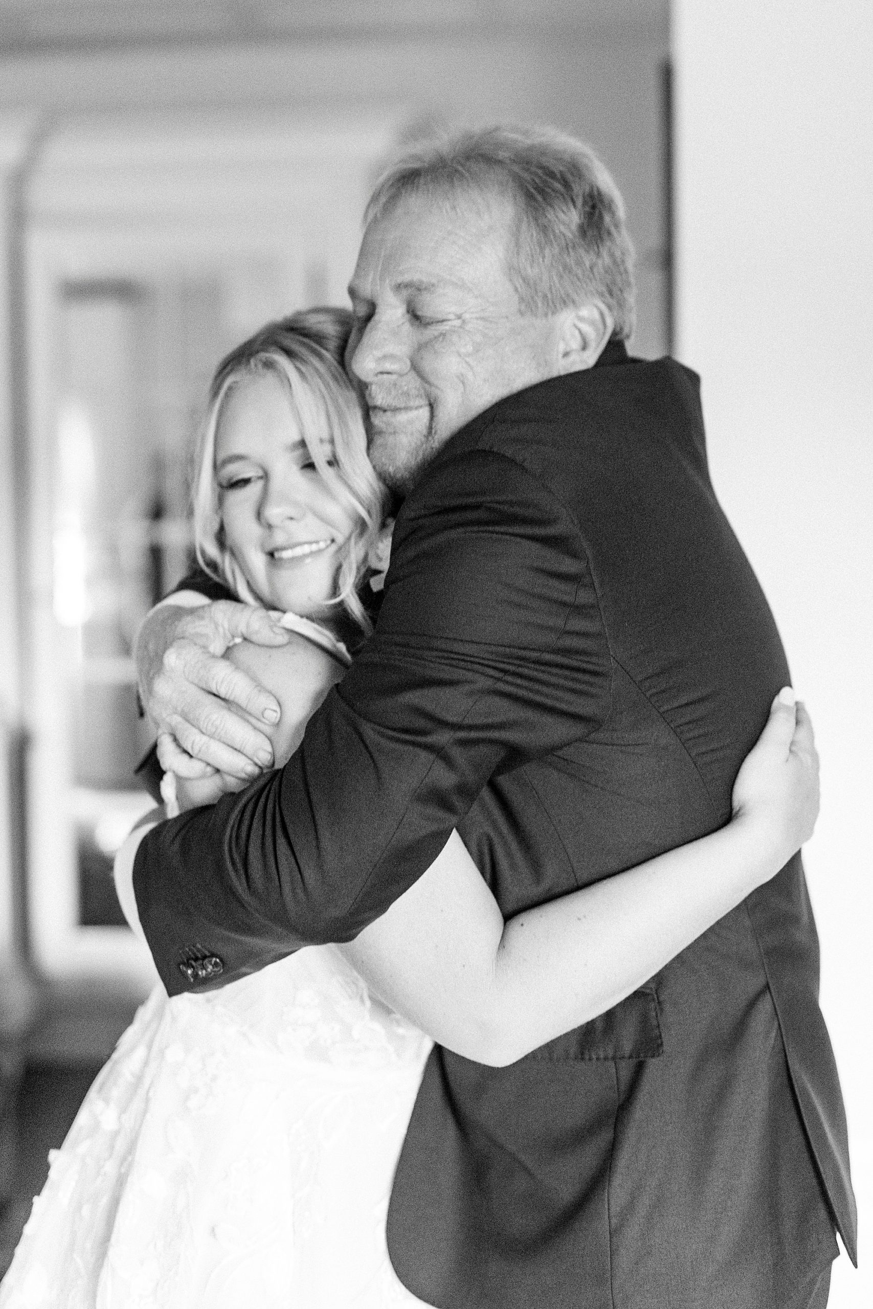 dad hugs daughter after first look