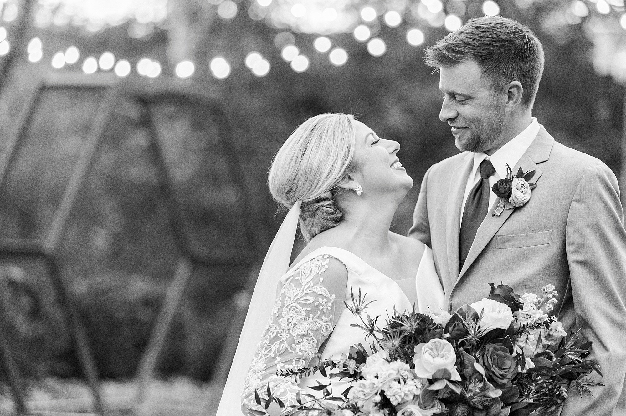 bride smiles up at groom during Vesuvius Vineyards wedding portraits