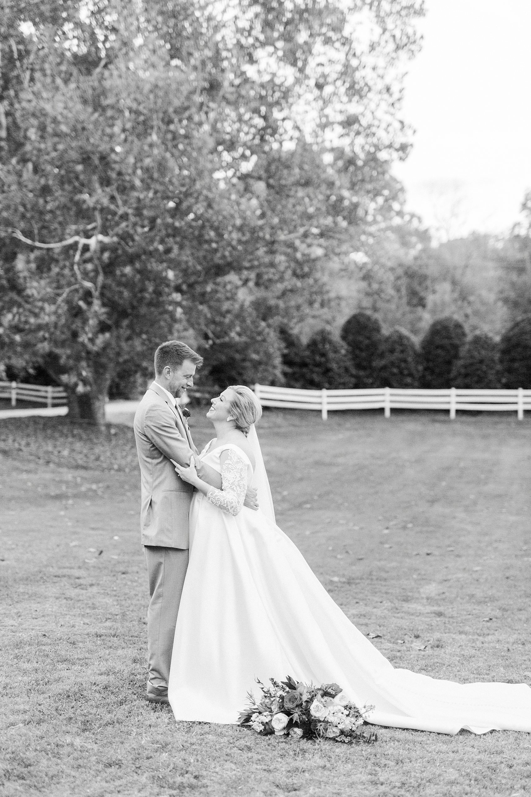bride looks up at groom during fall wedding day at Vesuvius Vineyards
