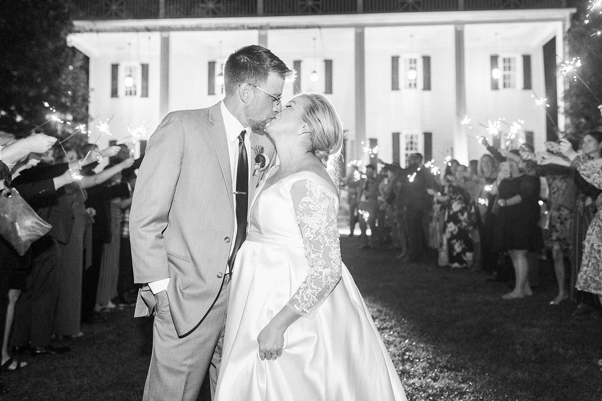 newlyweds kiss during sparkler exit at Vesuvius Vineyards