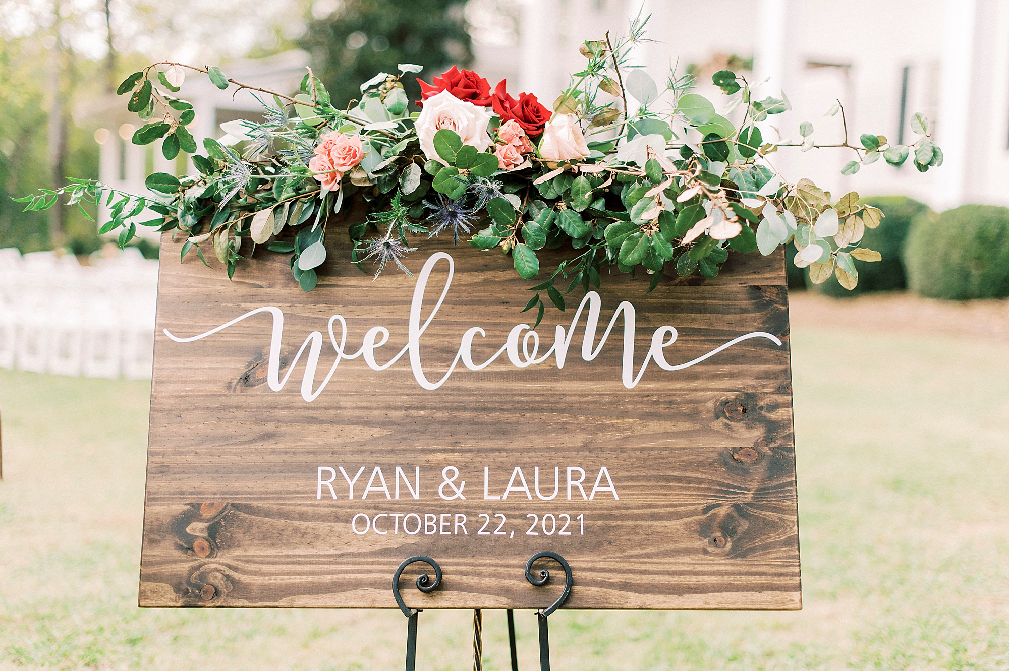 wooden sign with floral arrangement for Vesuvius Vineyards wedding