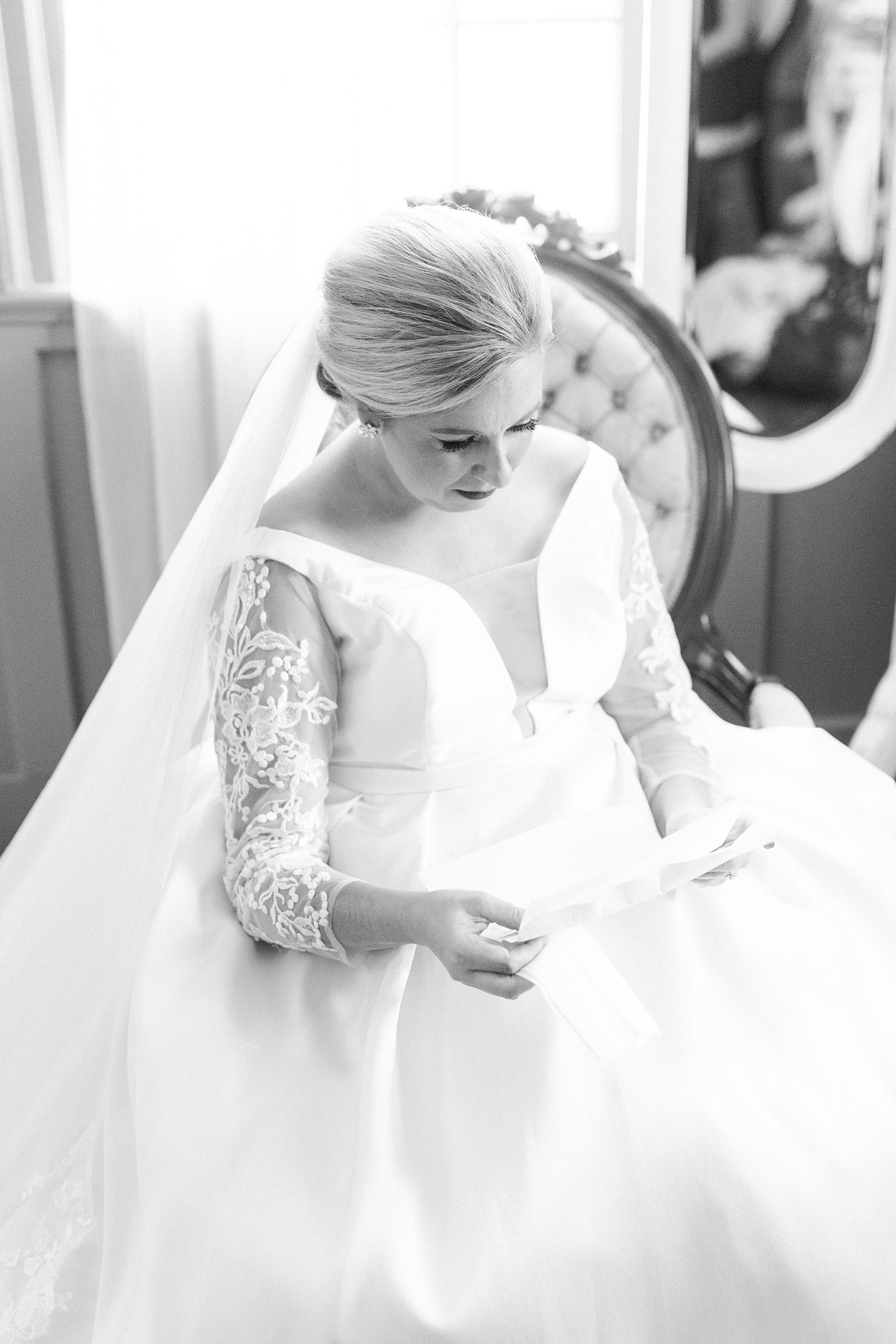bride reads letter on wedding day