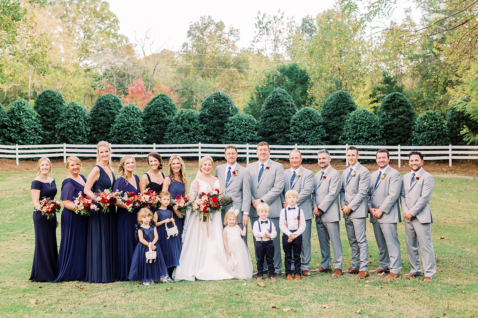 bride and groom pose with wedding party at Vesuvius Vineyards