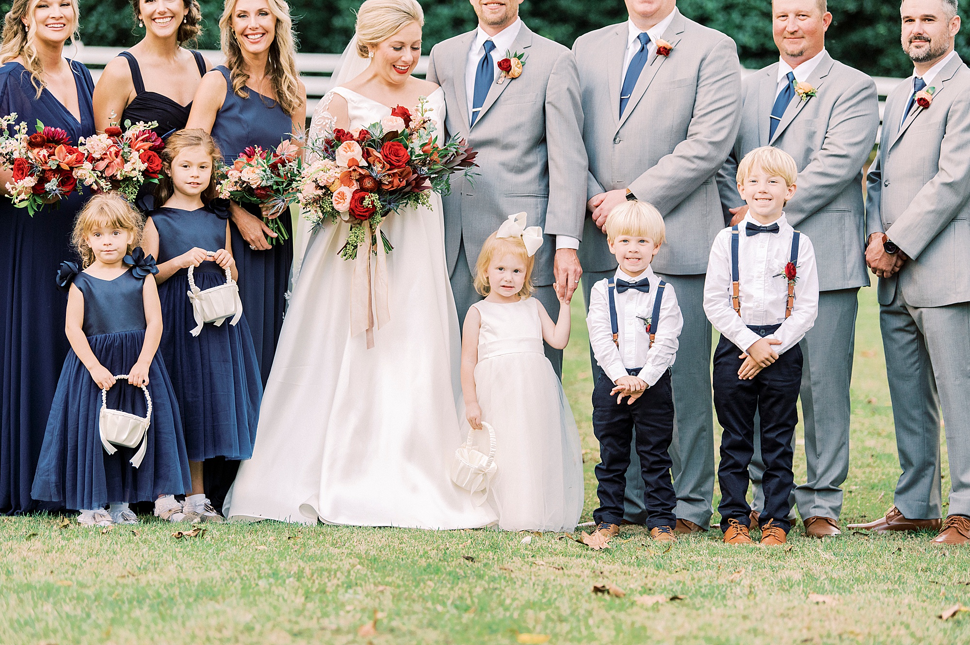 bride looks down at daughter during portraits at Vesuvius Vineyards