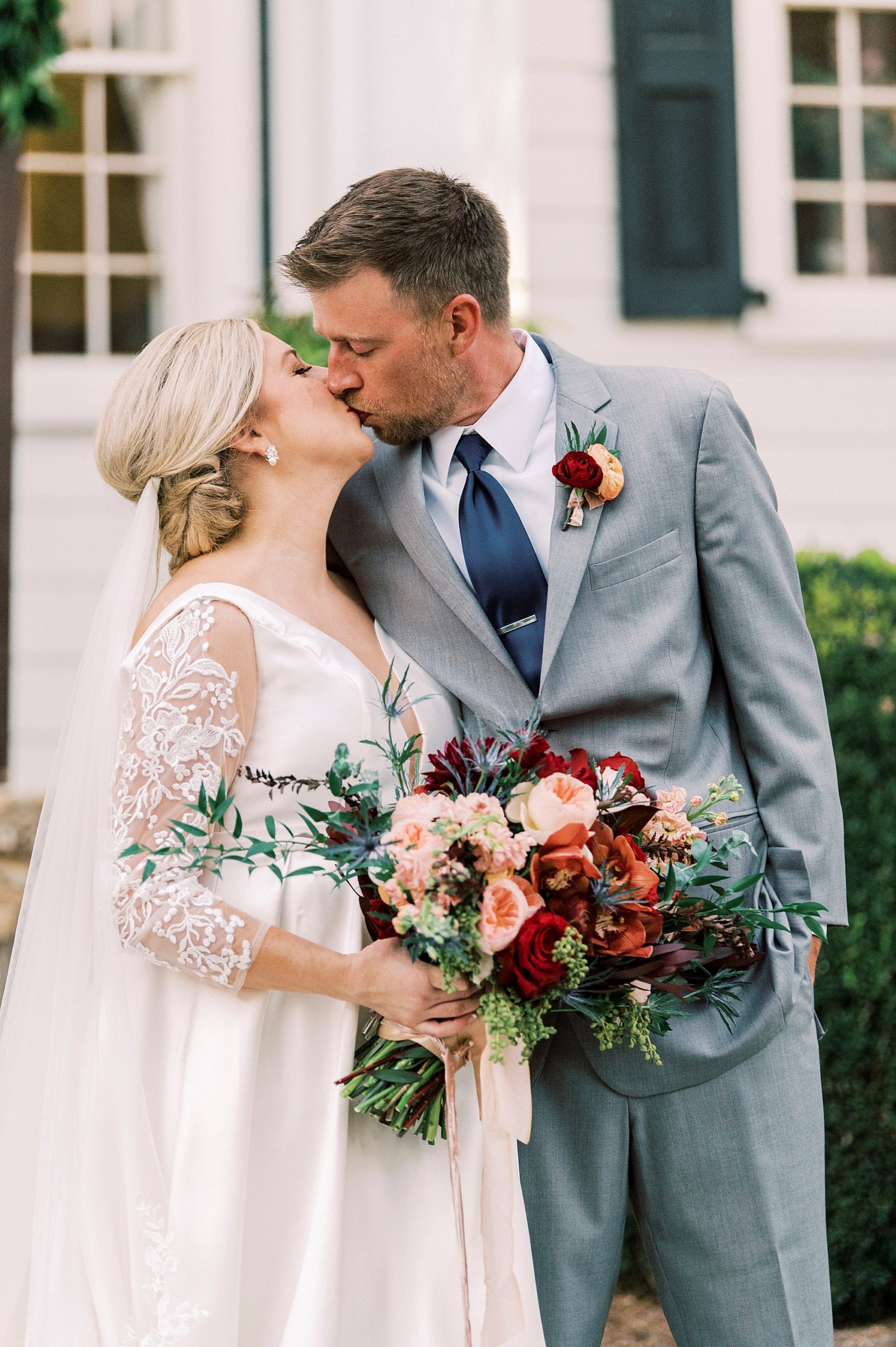 newlyweds kiss after wedding ceremony at Vesuvius Vineyards