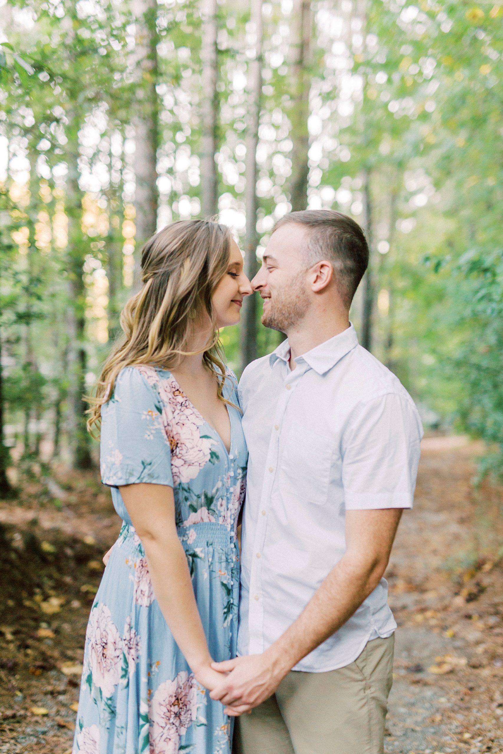 bride and groom nuzzle noses during Charlotte engagement session