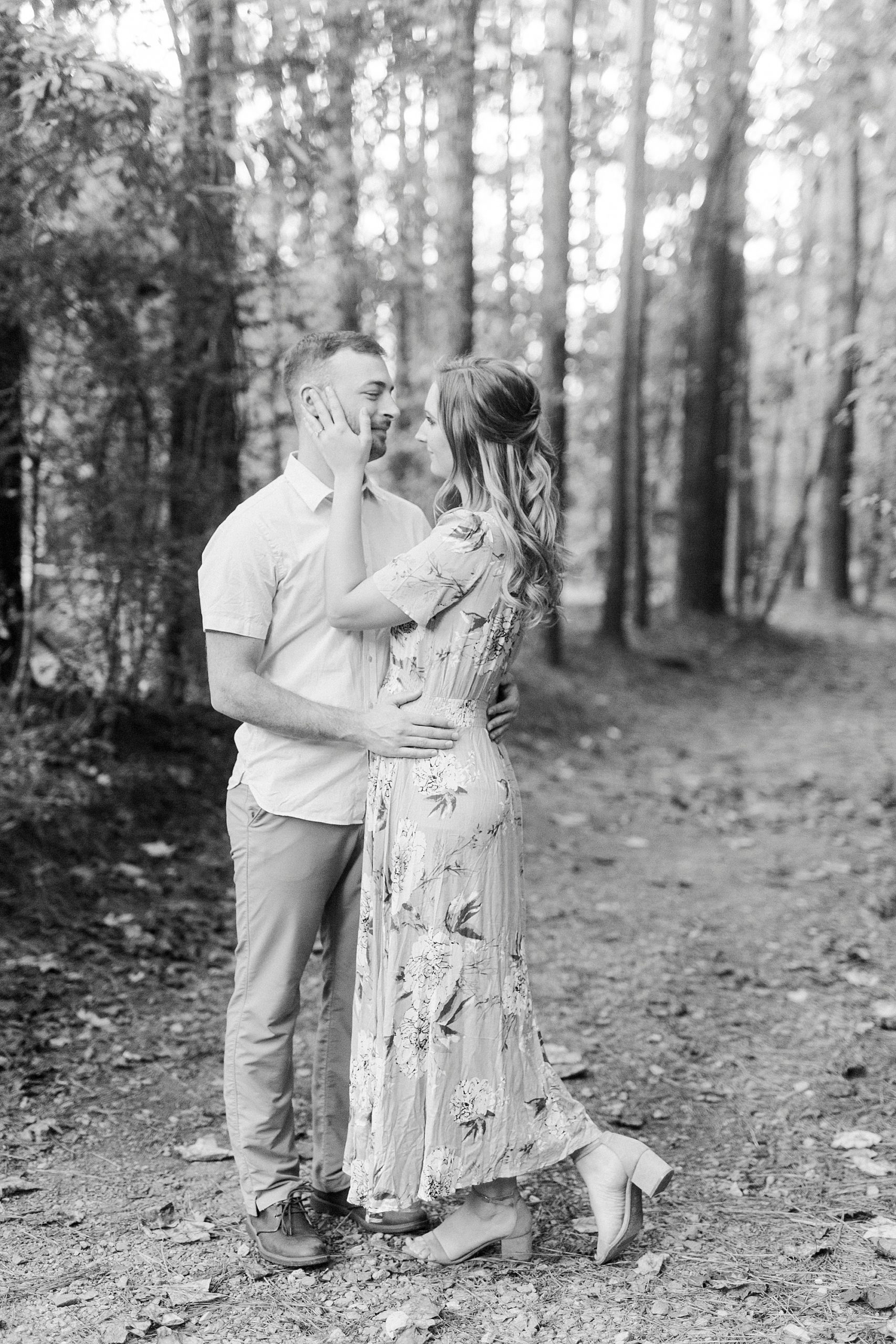 couple kisses on pathway at the Whitewater Center