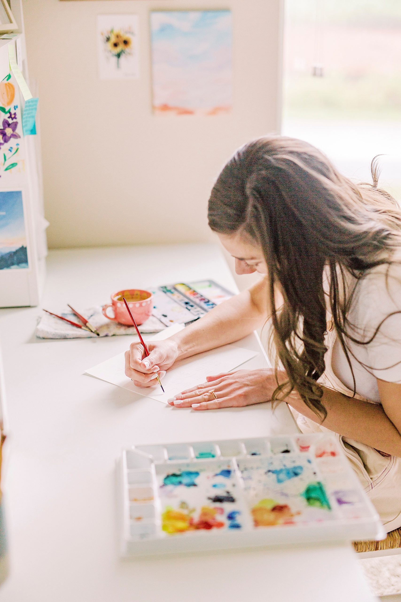 woman works during branding photos at home