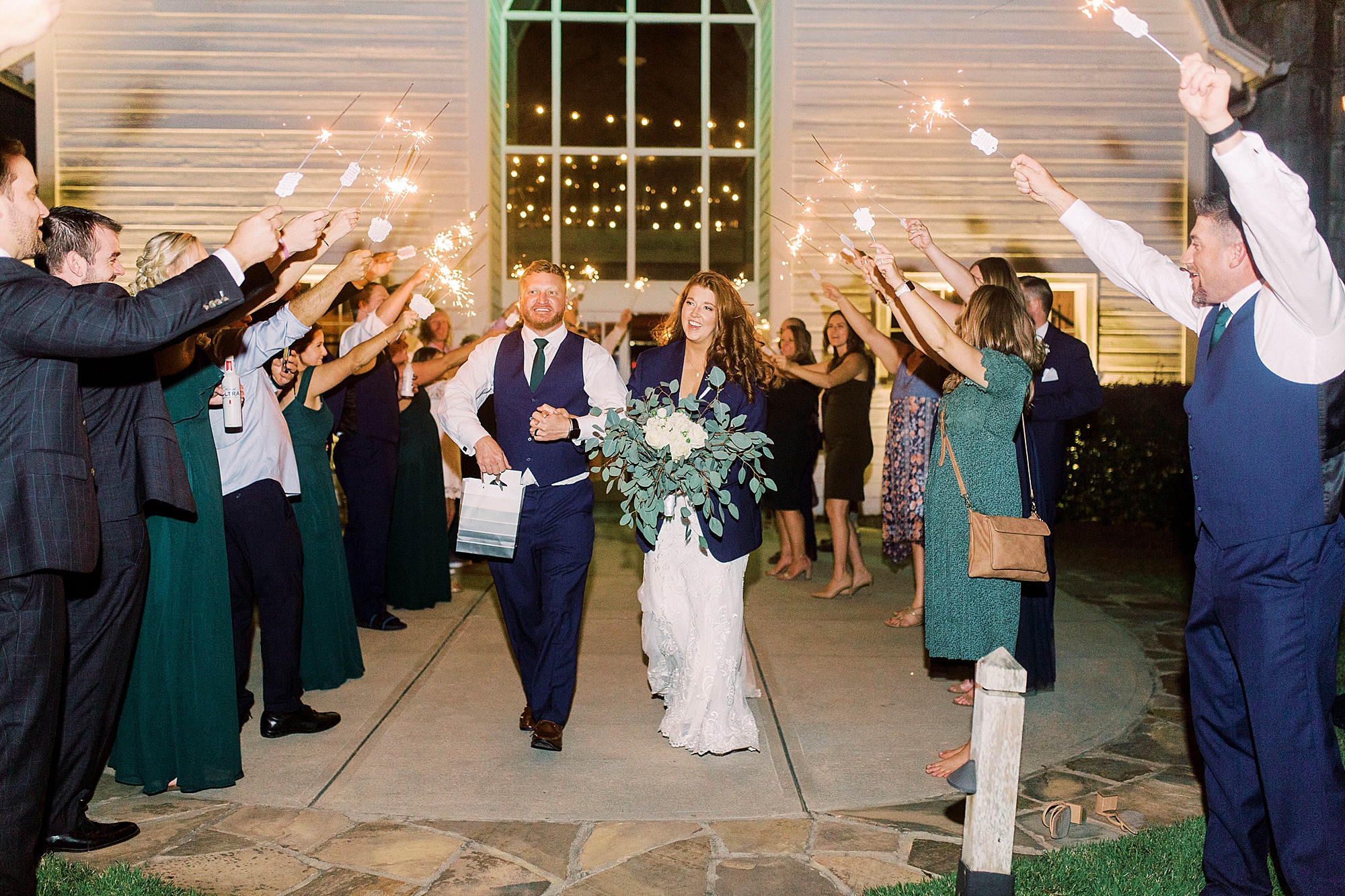 bride and groom walk through sparkler exit at the Dairy Barn
