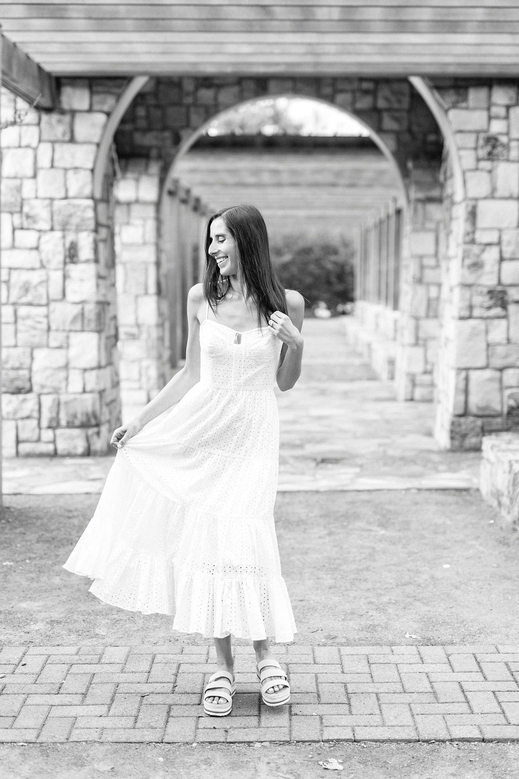 bride twirls white dress during Midtown Park engagement session