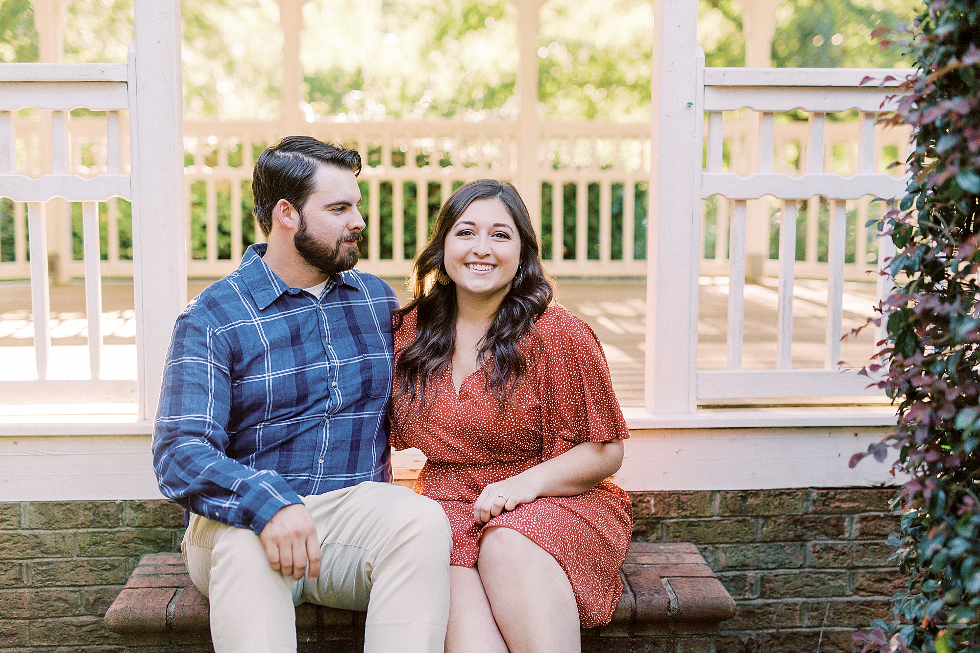 bride and groom sit on gazebo steps