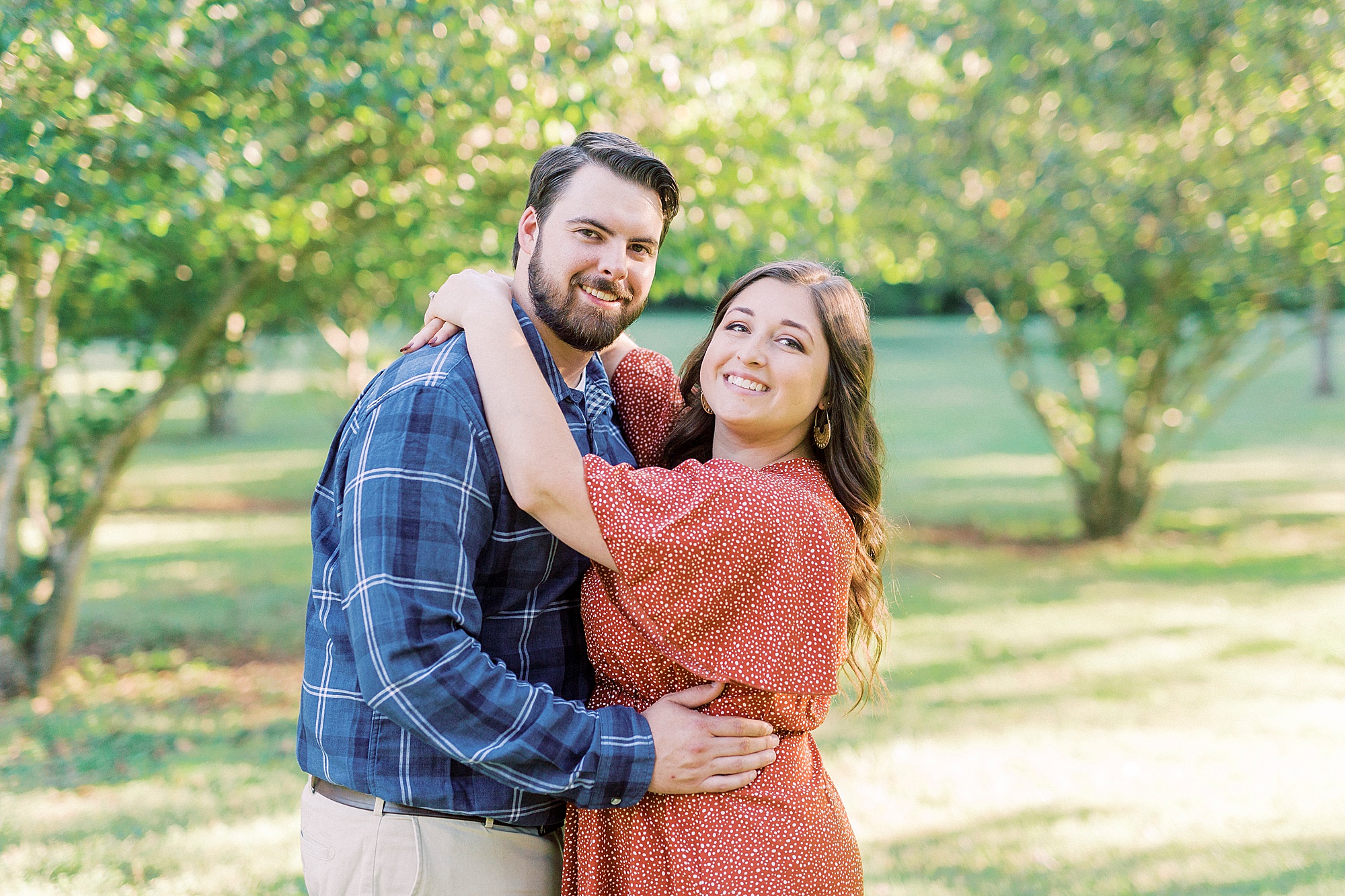 bride and groom hug during fall portraits at Sloan Park