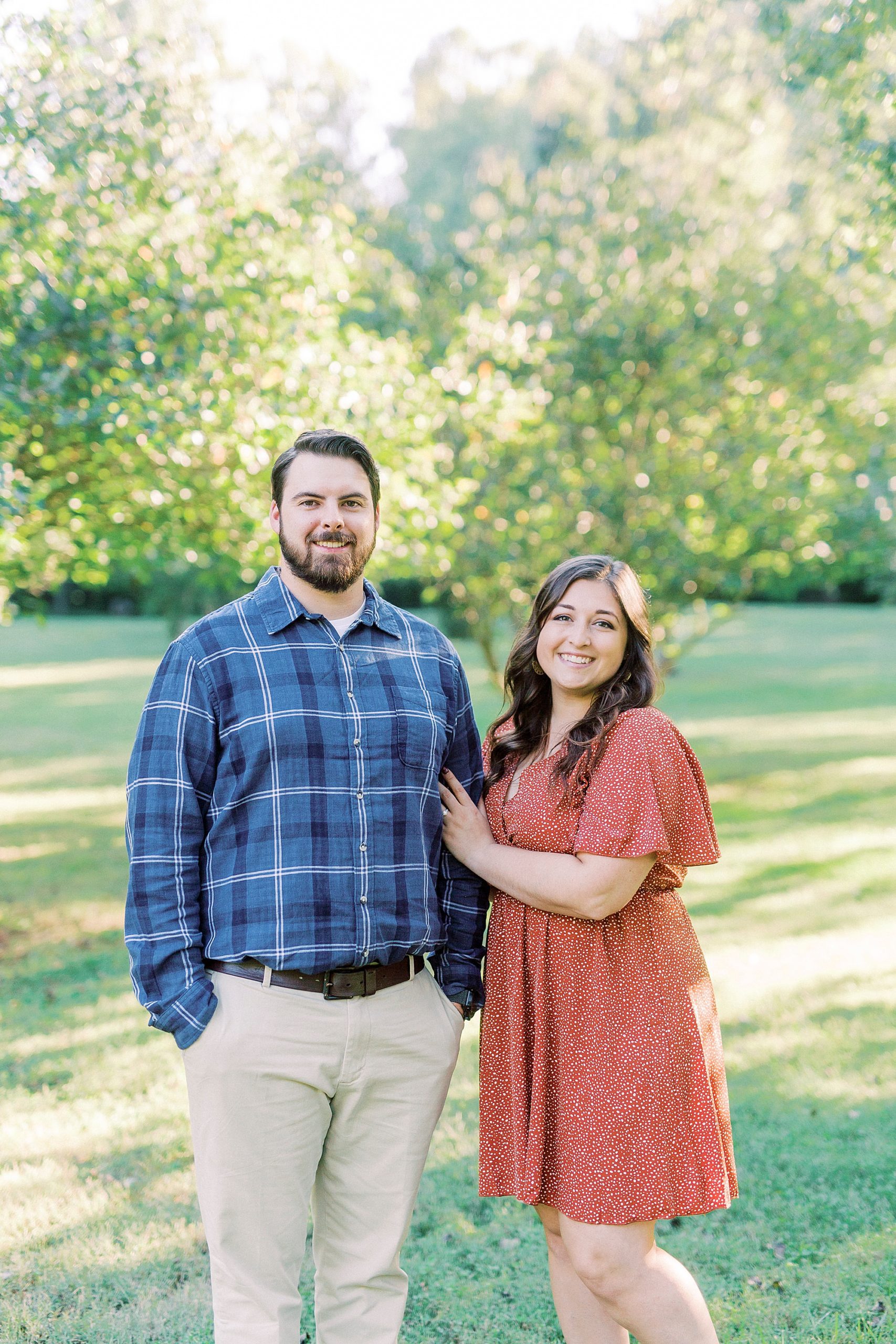 bride and groom pose in field at Sloan Park