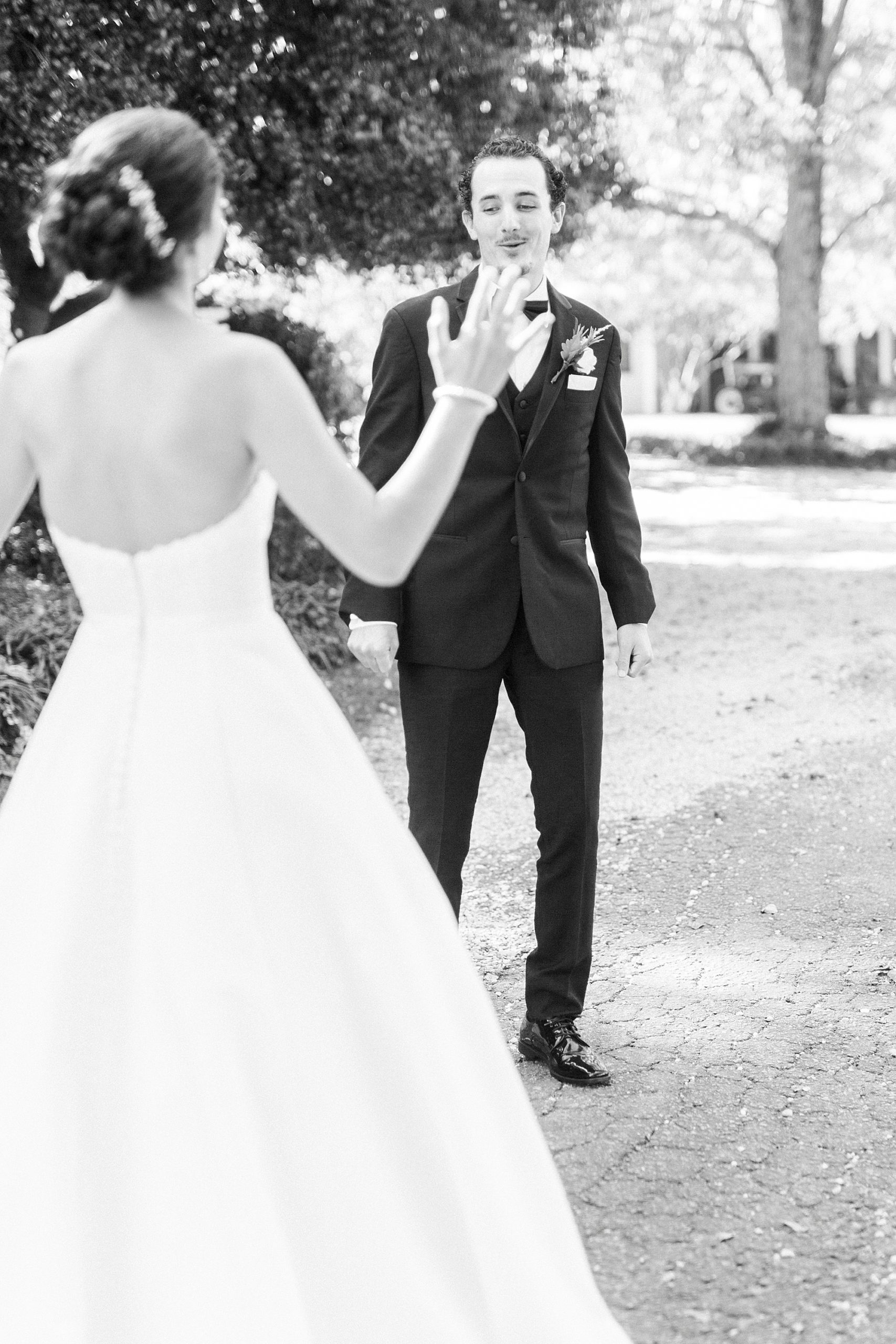 groom reacts to seeing bride during first look before 1812 Hitching Post wedding