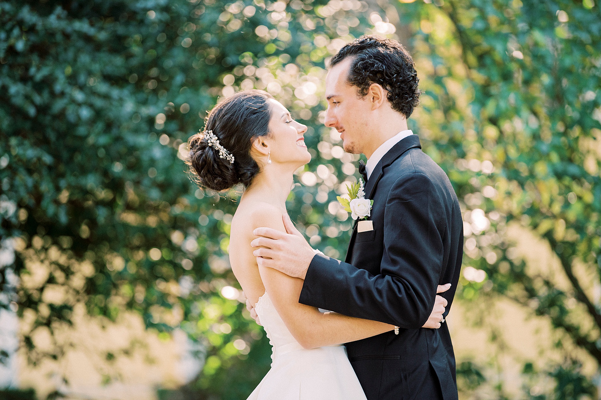 bride and groom hug during first look at 1812 Hitching Post