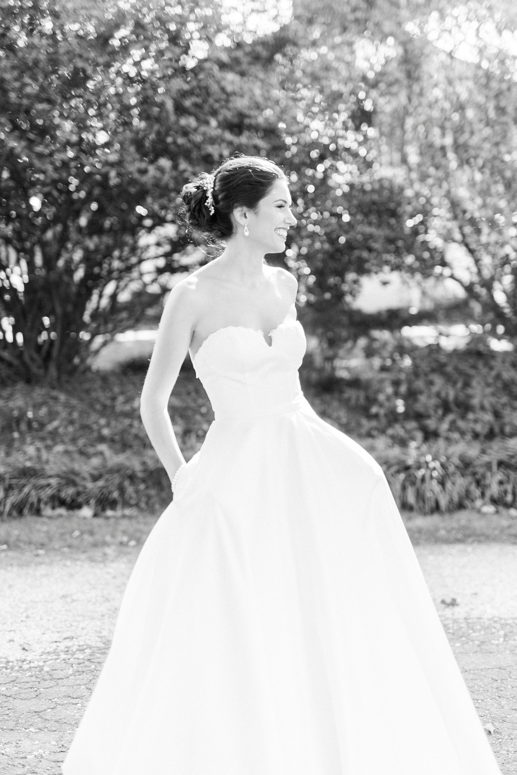 bride shows off wedding dress during first look at 1812 Hitching Post