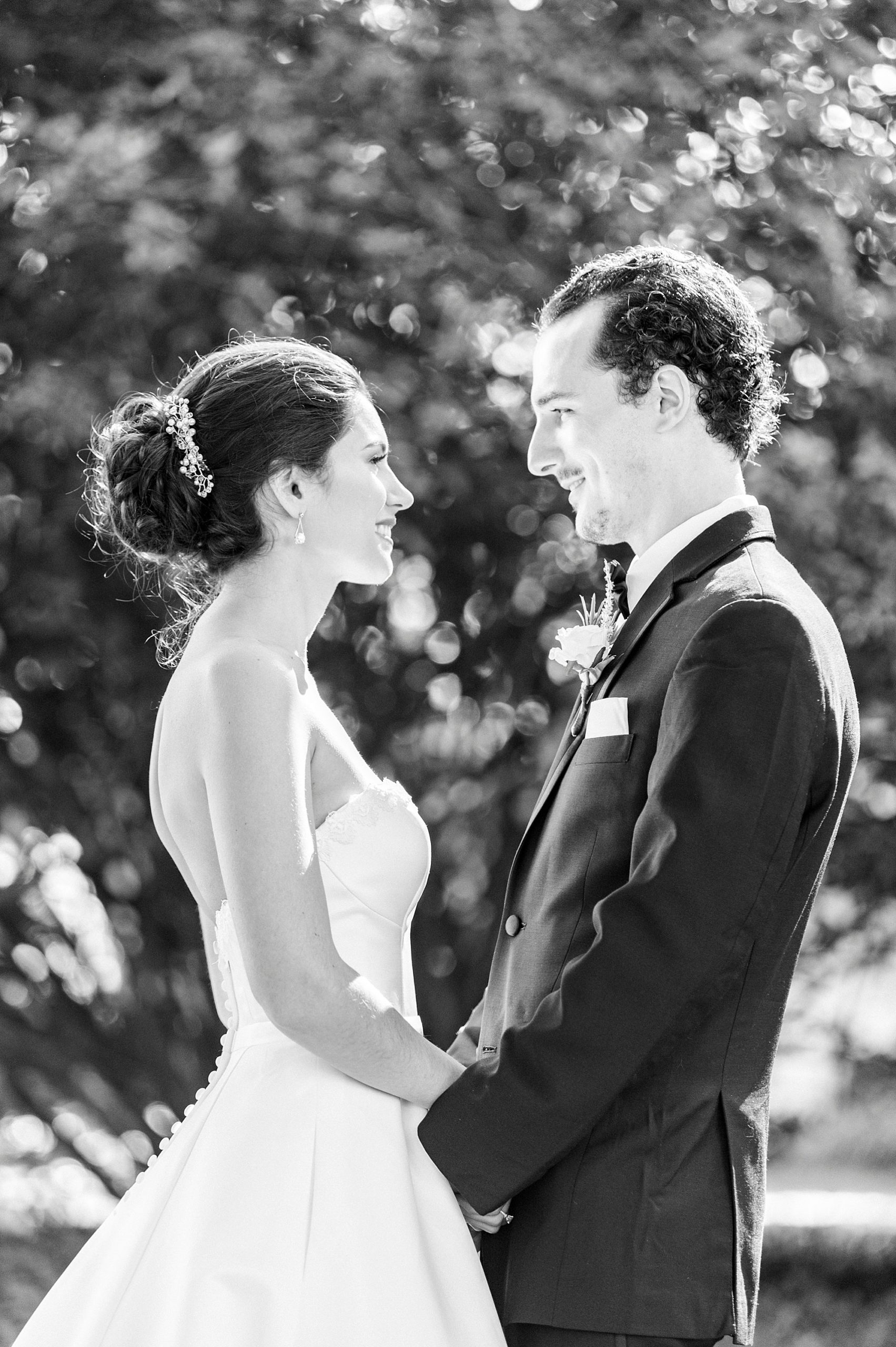bride and groom smile together during first look