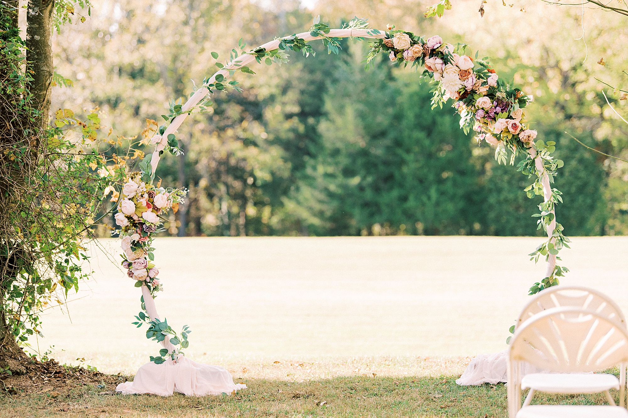 floral circular arbor for 1812 Hitching Post wedding ceremony