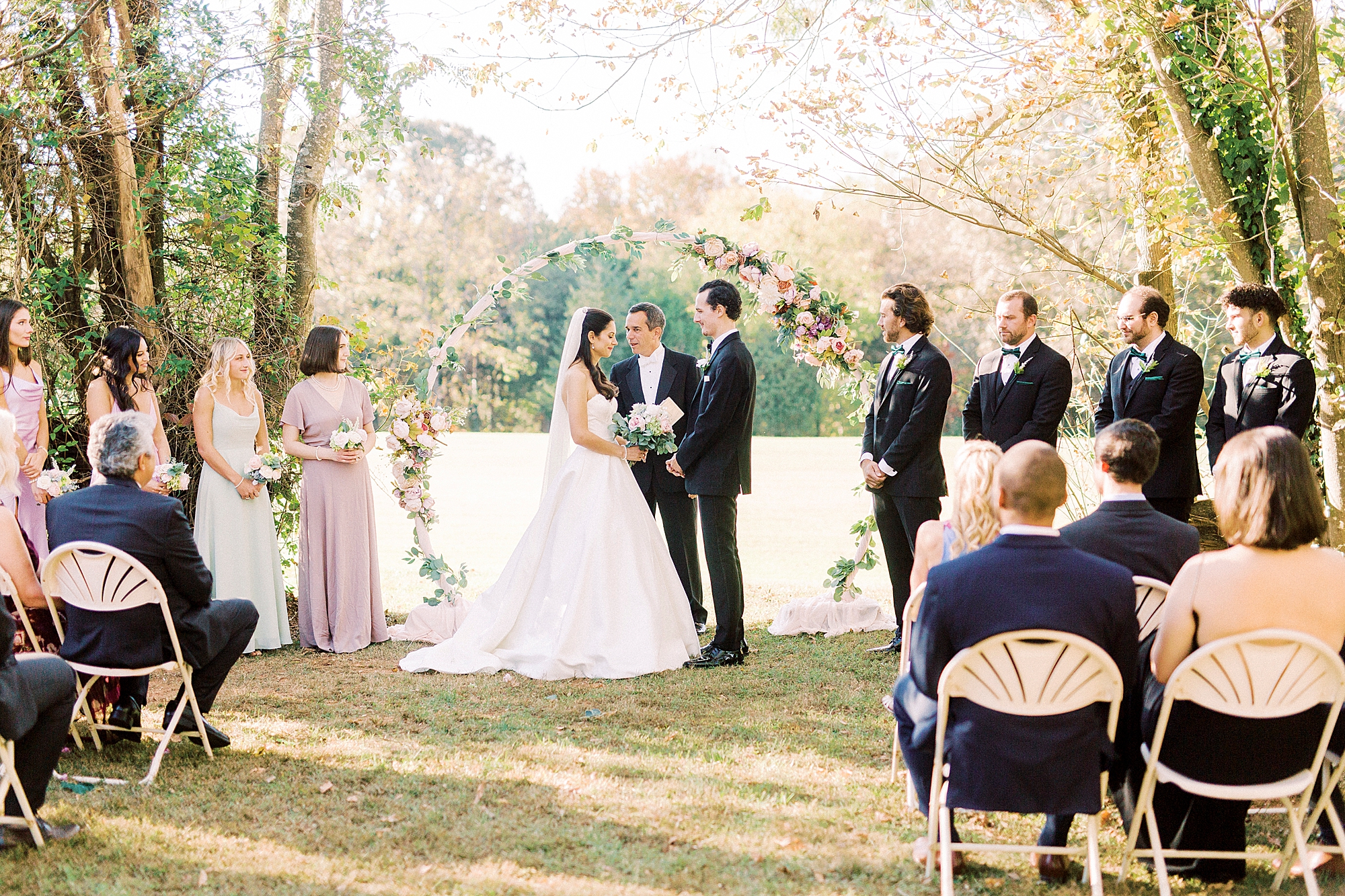 newlyweds exchange vows during outdoor wedding ceremony in North Carolina