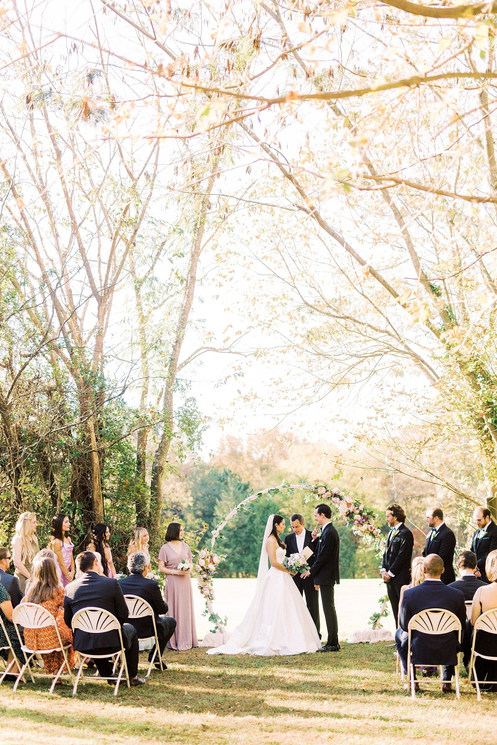 couple exchanges vows during outdoor wedding ceremony in North Carolina