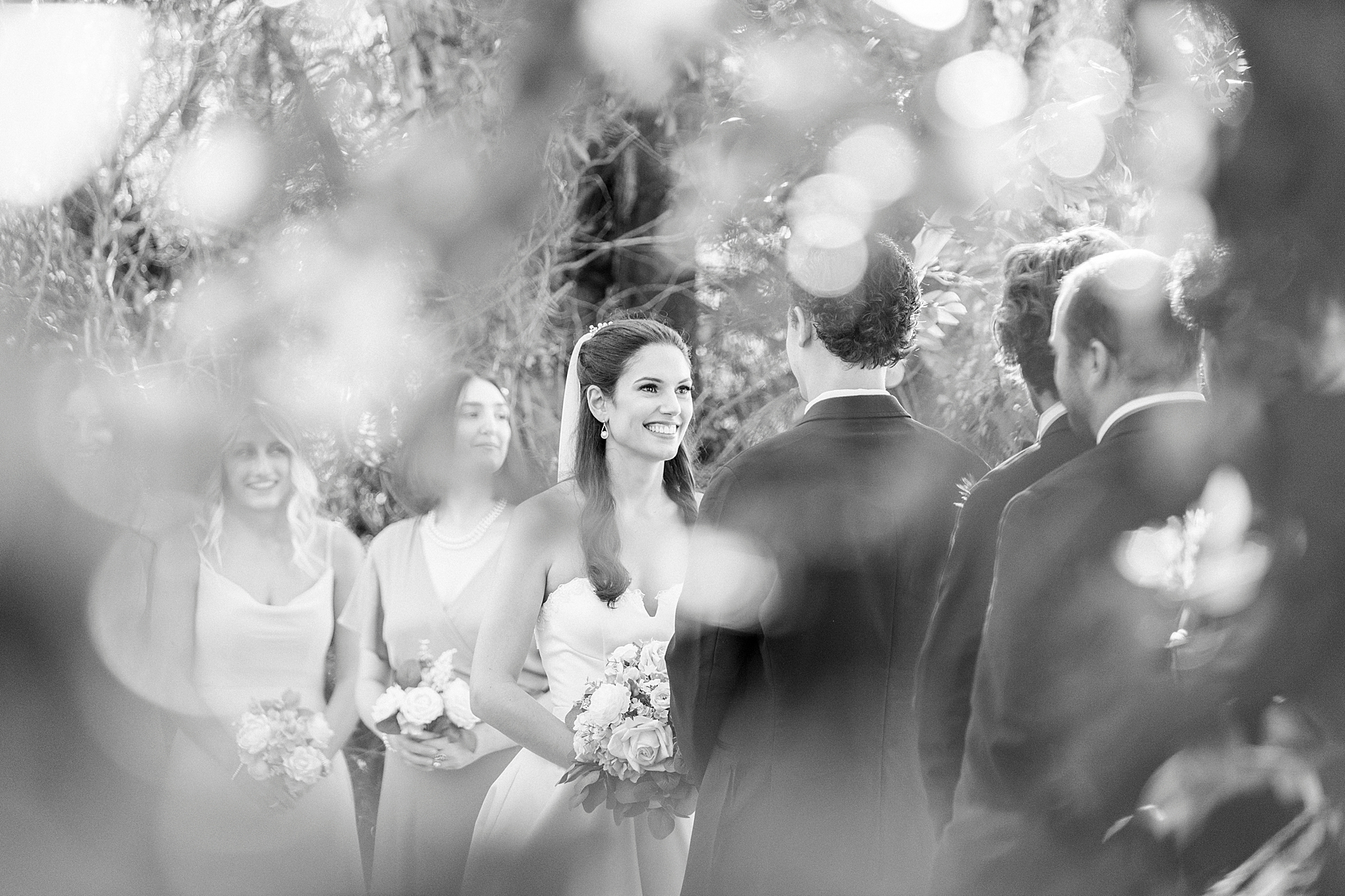 bride smiles at groom during outdoor wedding ceremony in North Carolina