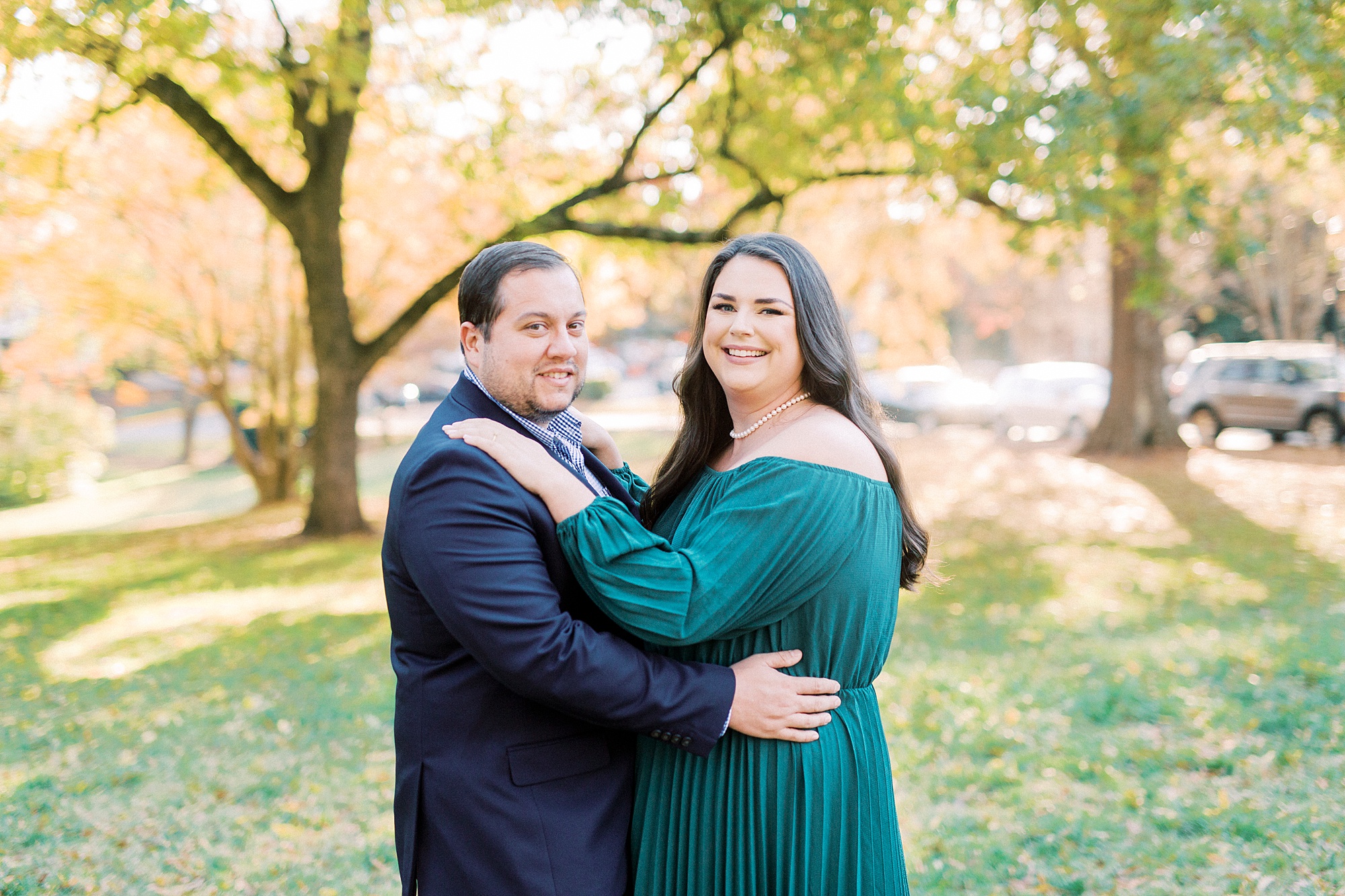 bride and groom hug during fall engagement photos