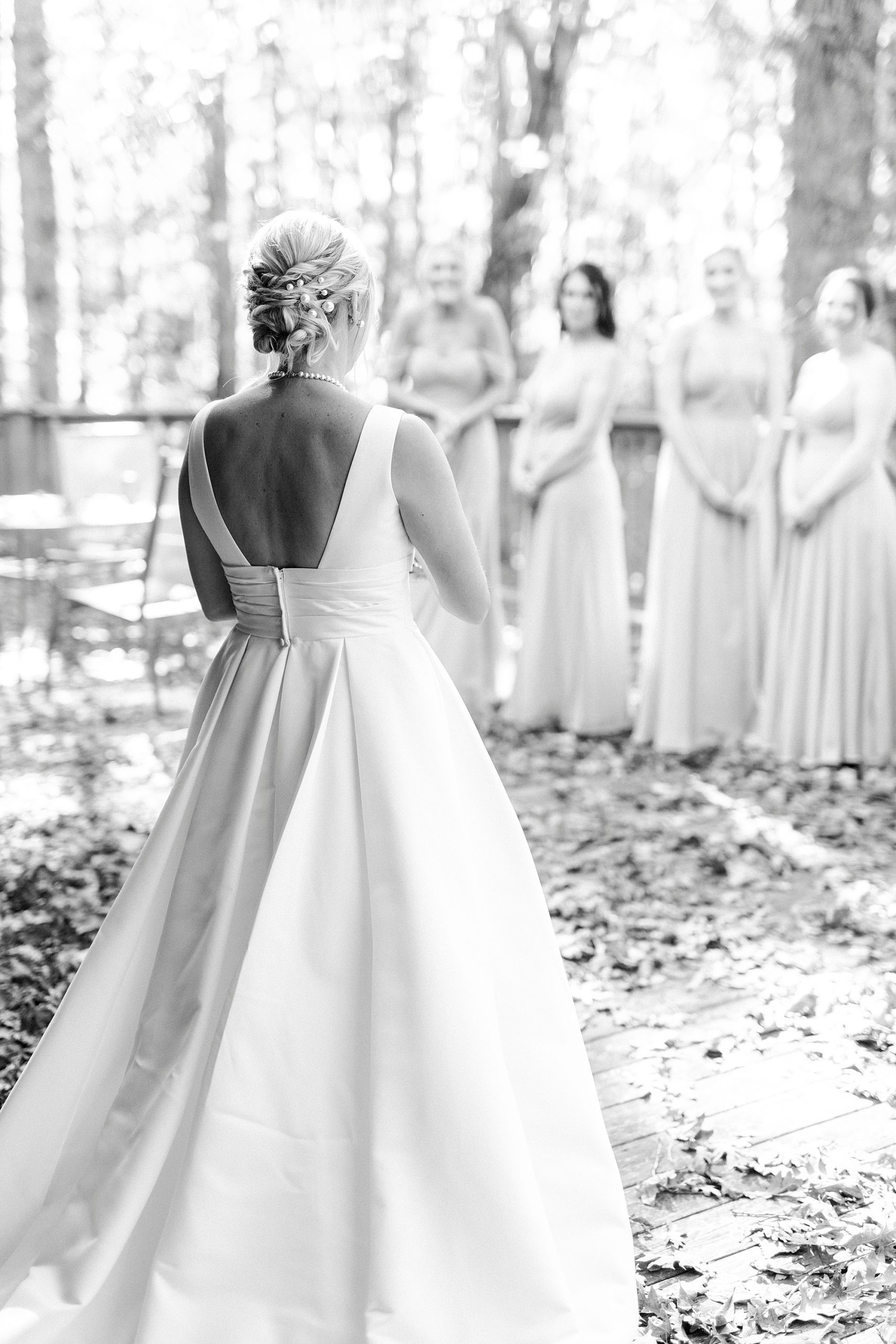 bride as first look with bridesmaids before Farm at Brusharbor wedding