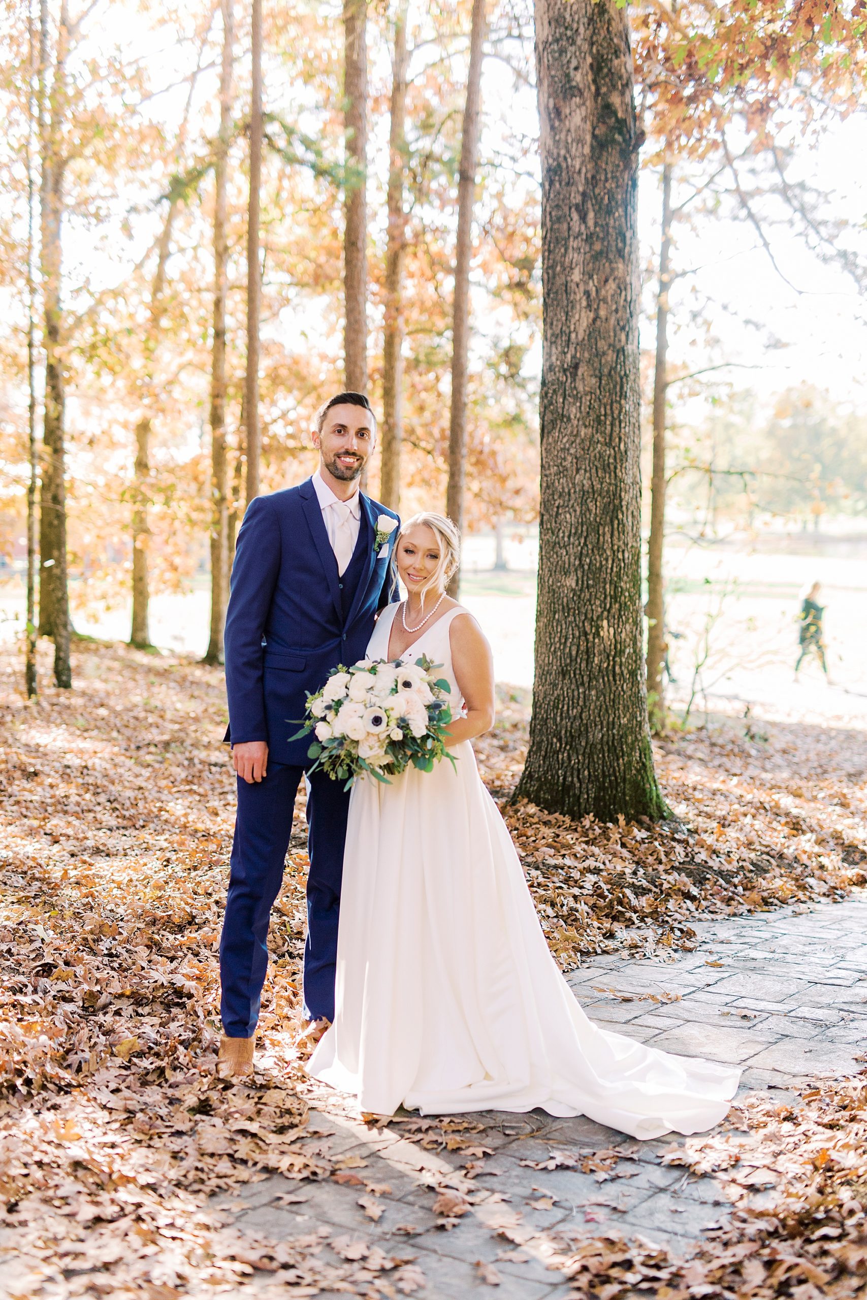 bride and groom pose in woods before wedding at the Farm at Brusharbor