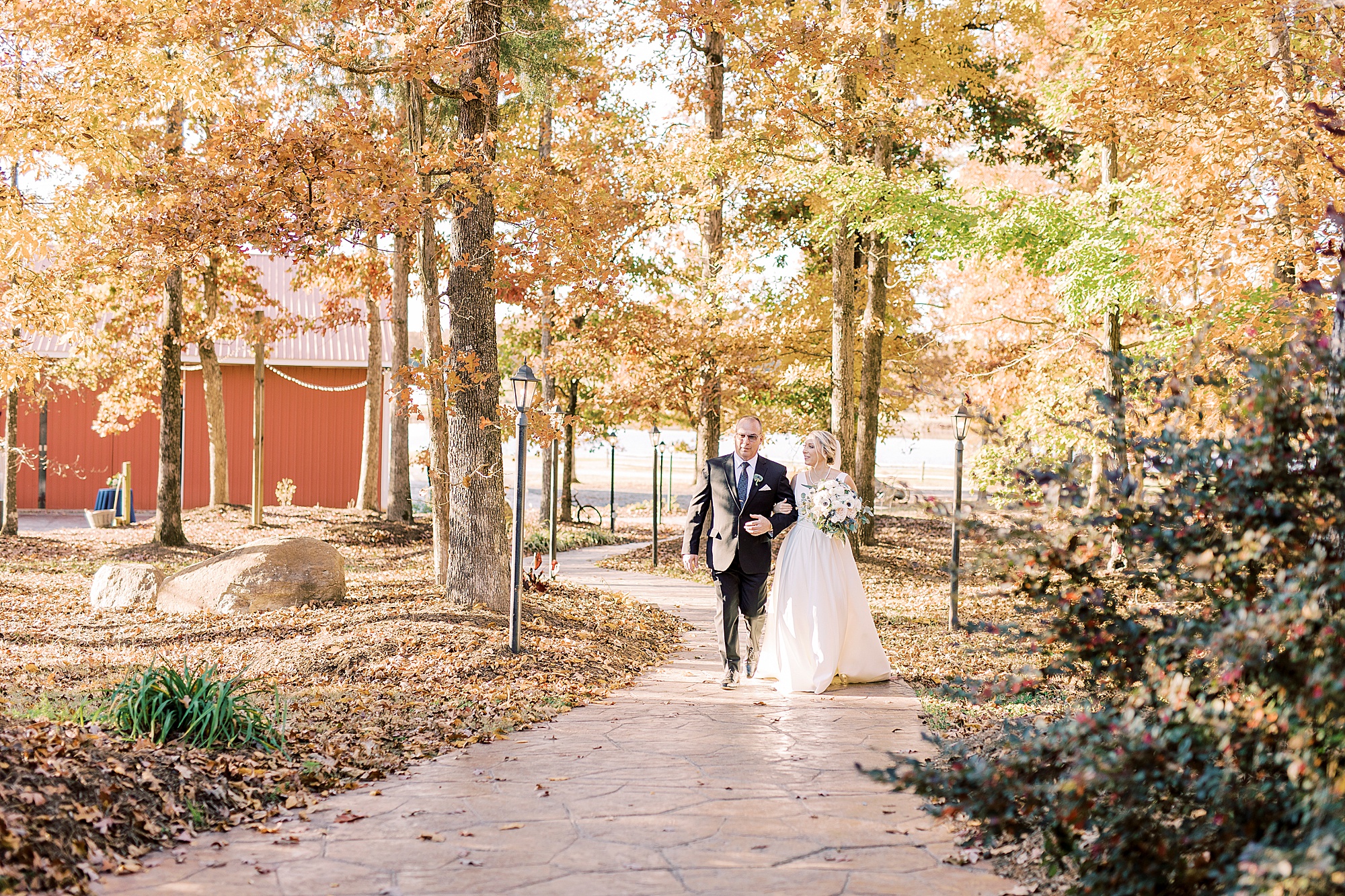 bride walks down aisle for wedding ceremony
