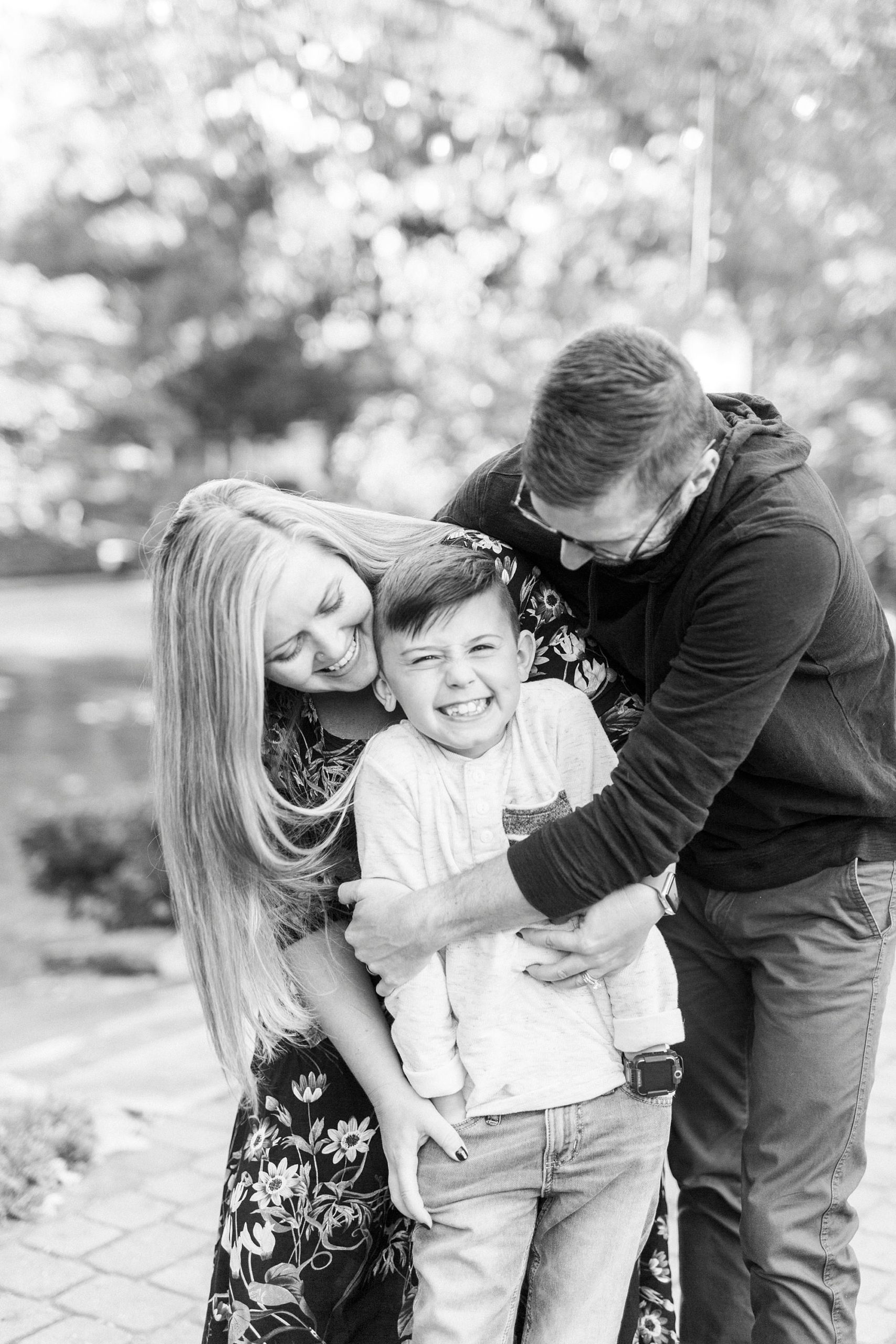 parents make son laugh during family photos at Ritchie Hill