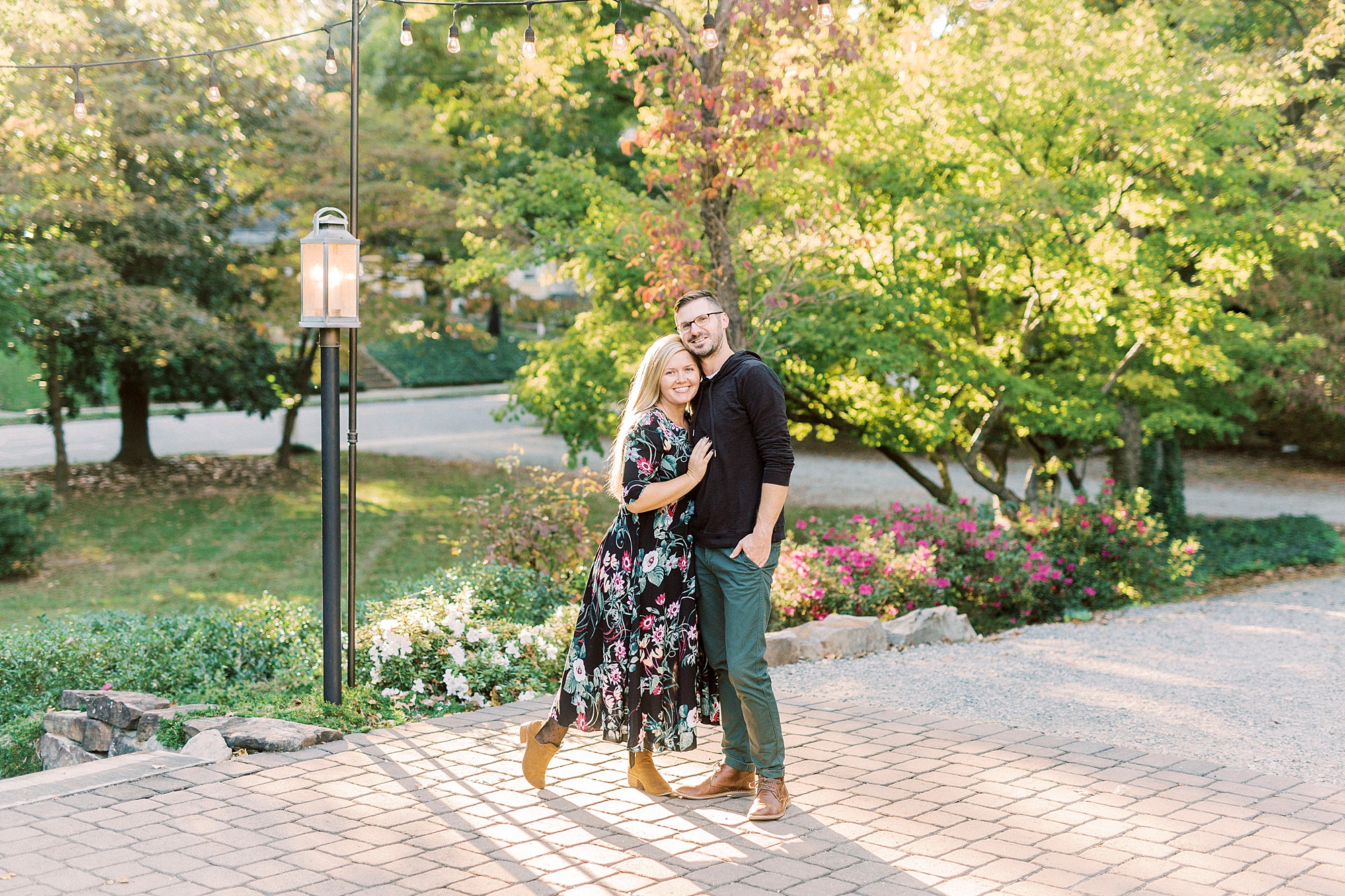 woman and husband stand together on patio at Ritchie Hill