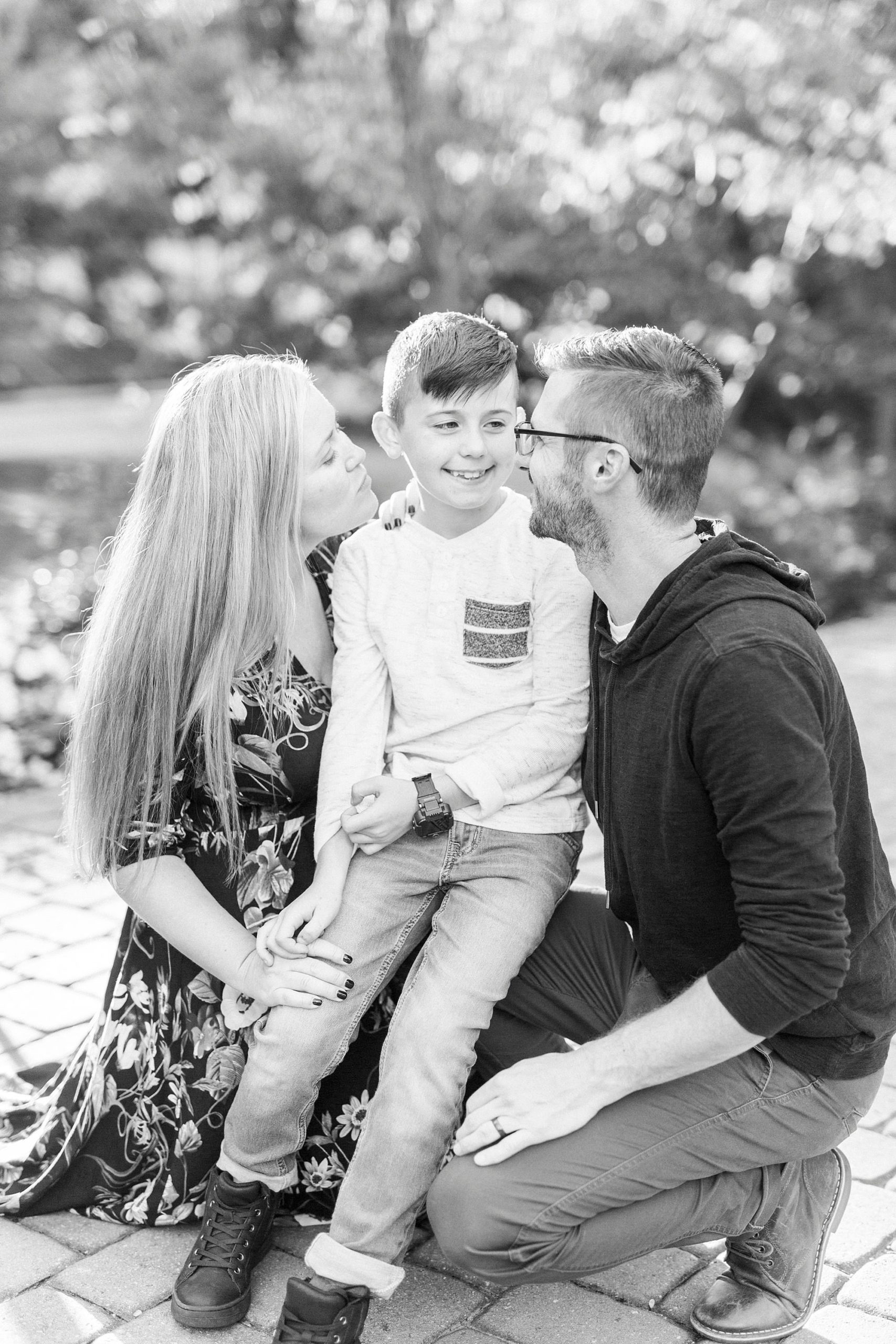 parents hug son during family photos at Ritchie Hill