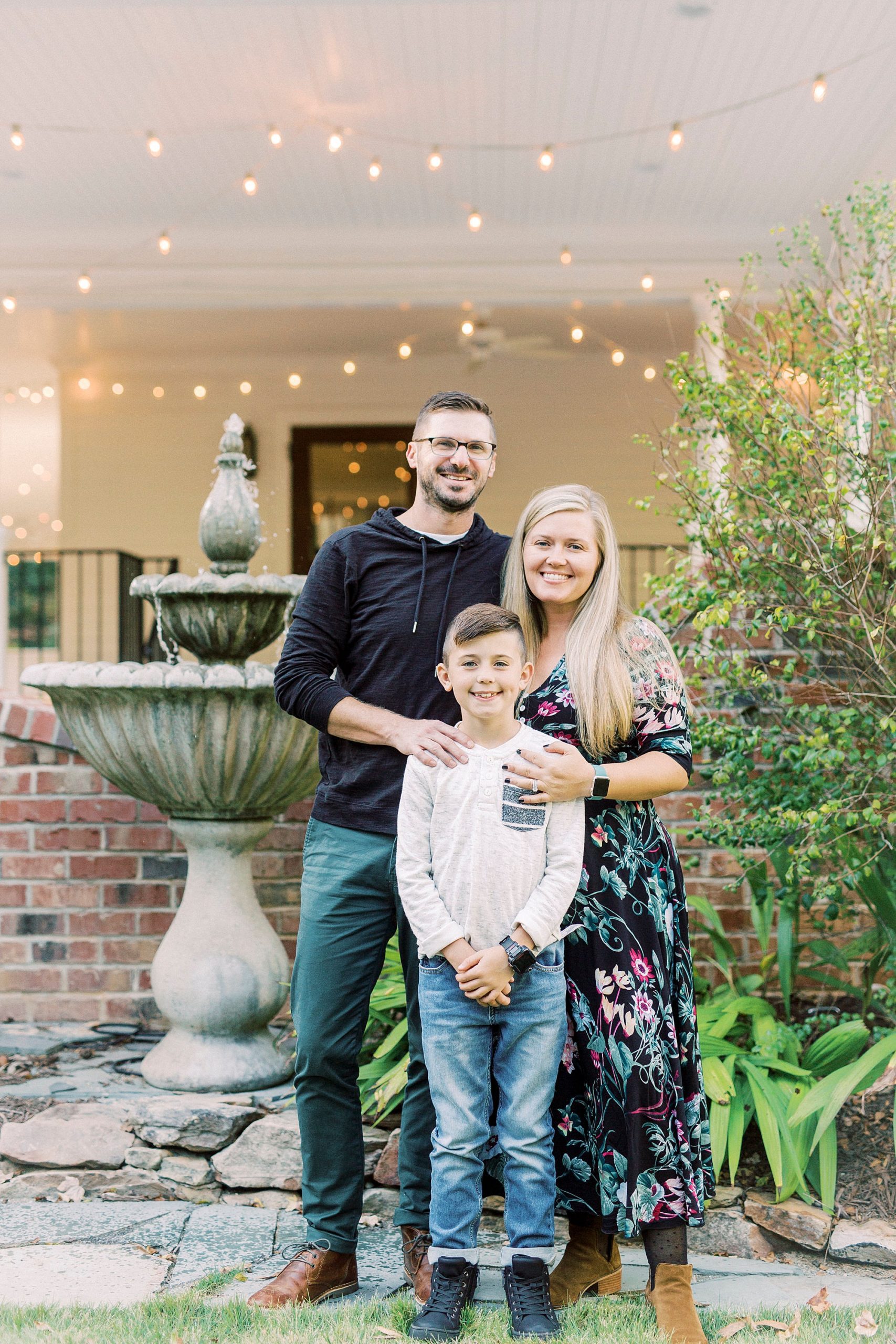 family of three poses outside Ritchie Hill in Concord NC