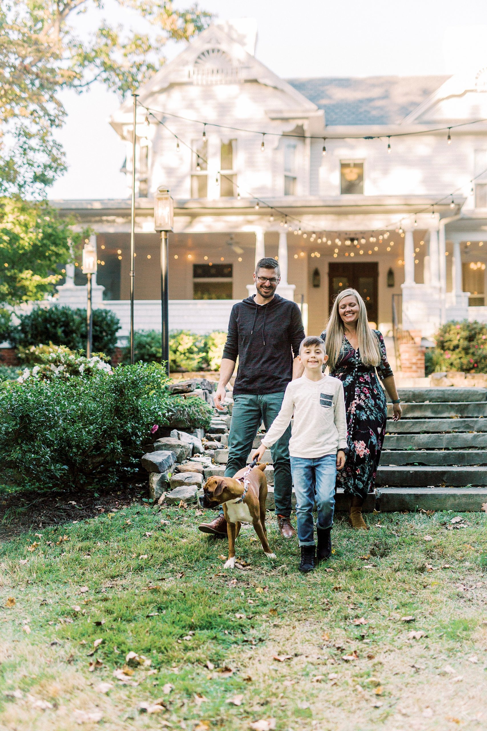 family of three walks down steps at Ritchie Hill