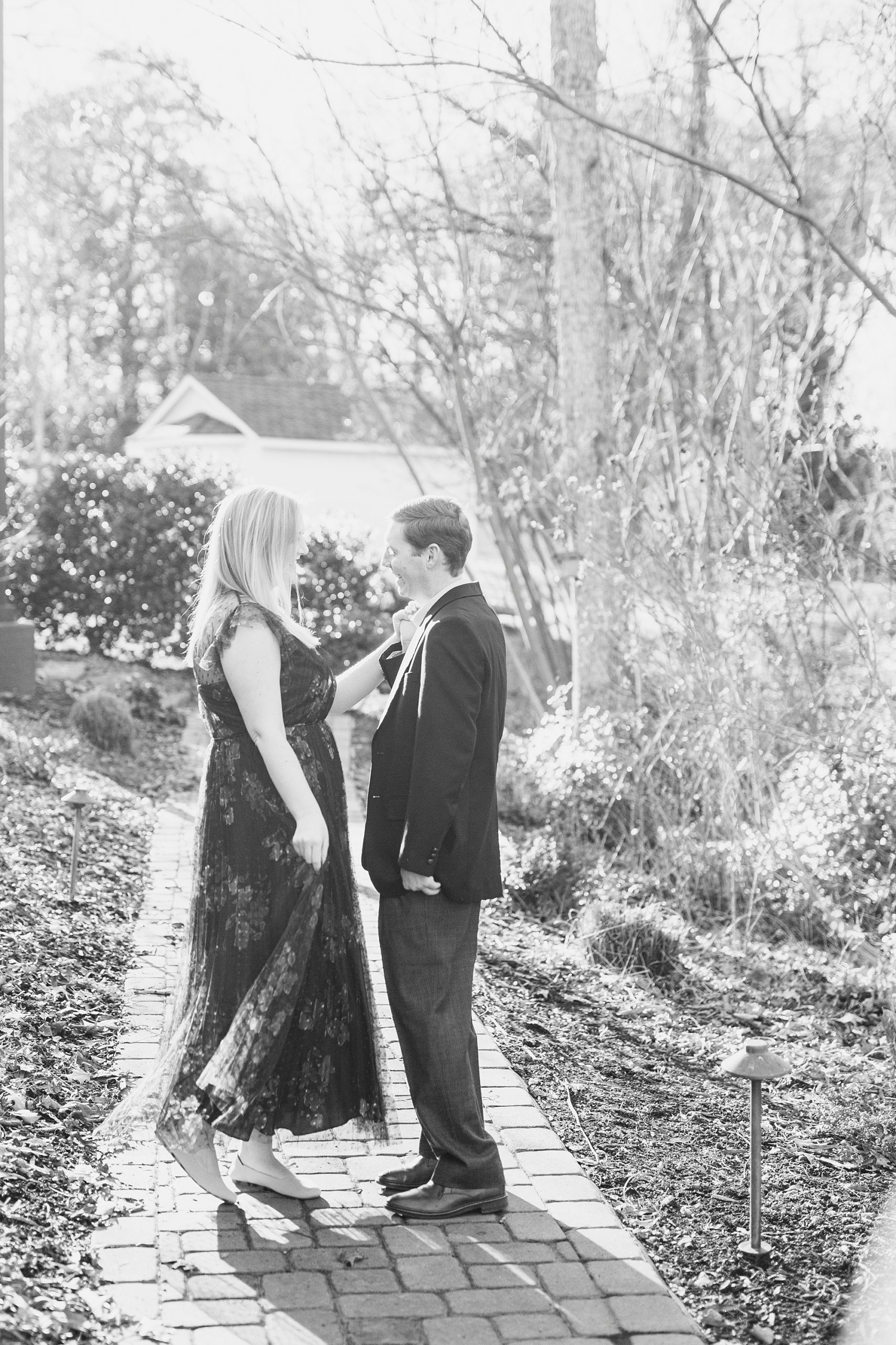bride and groom pose in pathway at Ritchie Hill