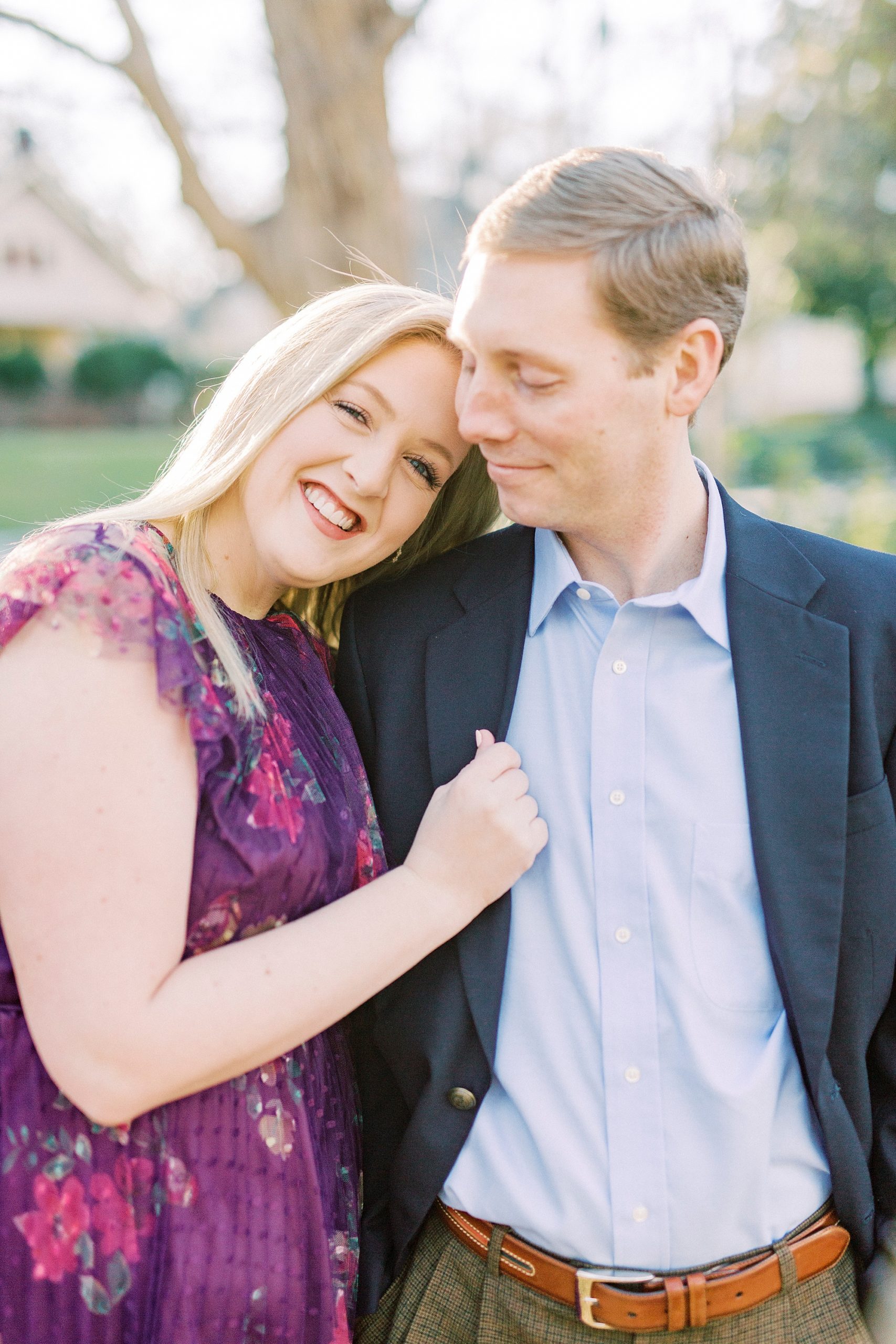bride leans on groom's shoulder during Ritchie Hill engagement session