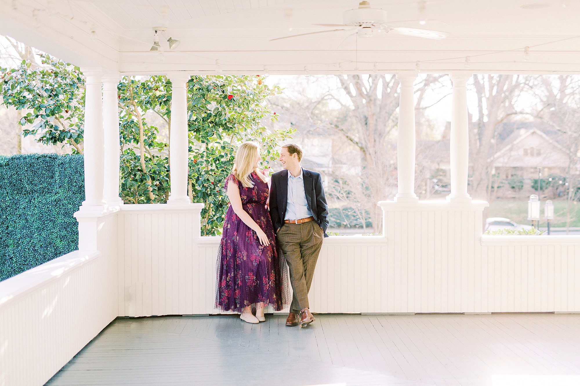 bride and groom sit together on patio at Ritchie Hill