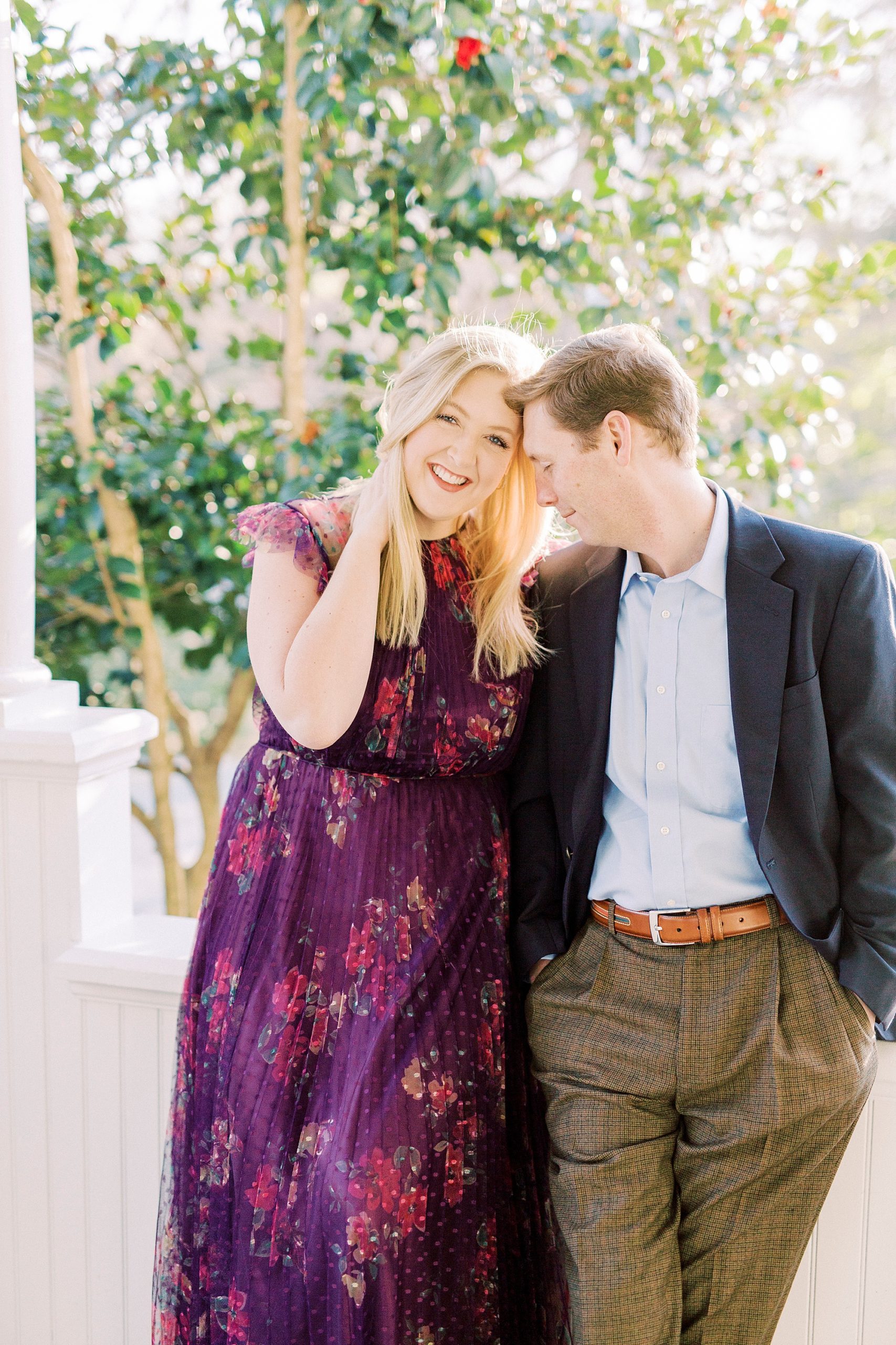 groom leans into bride's head during NC engagement photos at Ritchie Hill