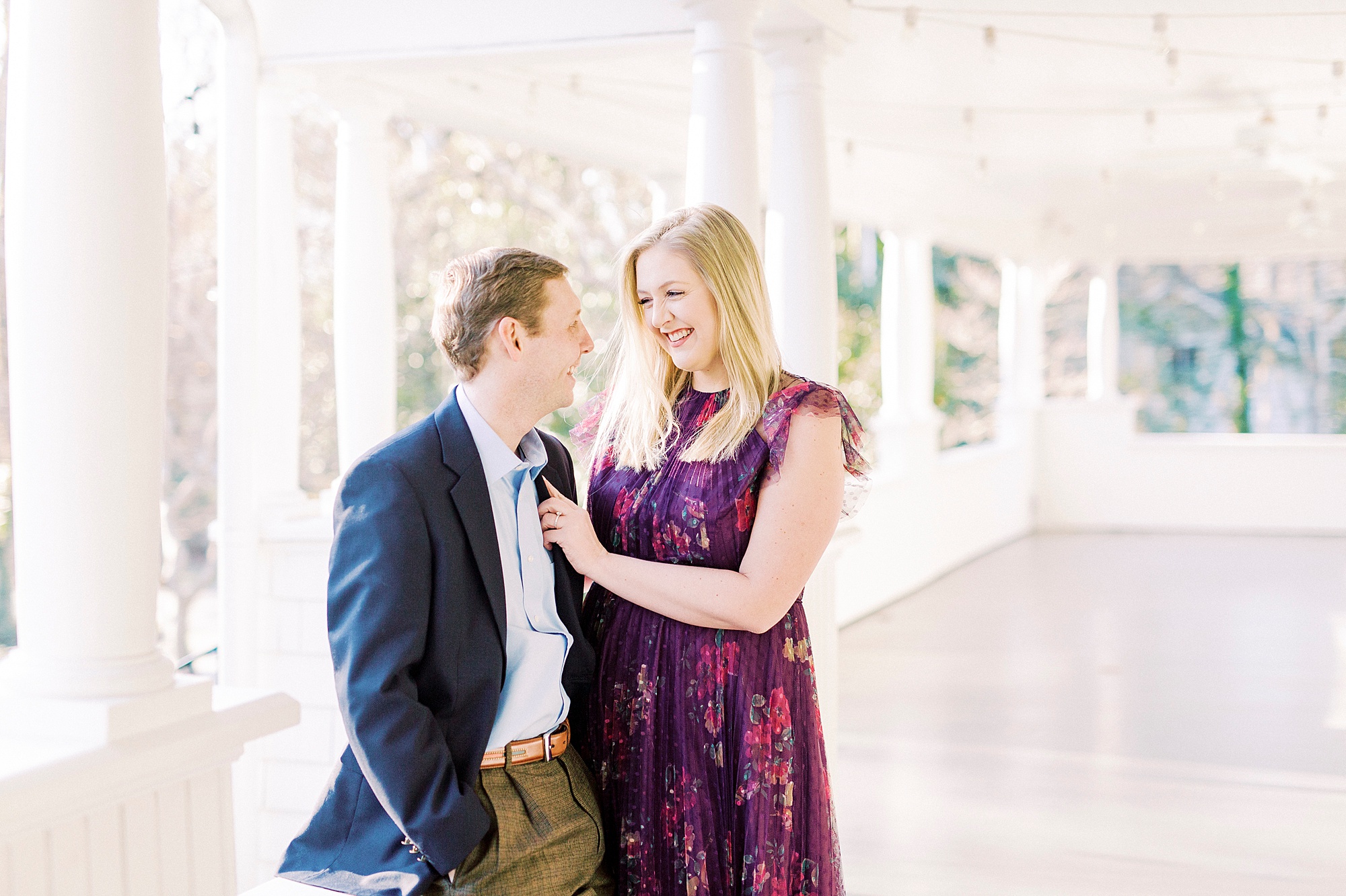 bride and groom laugh together on patio at Ritchie Hill